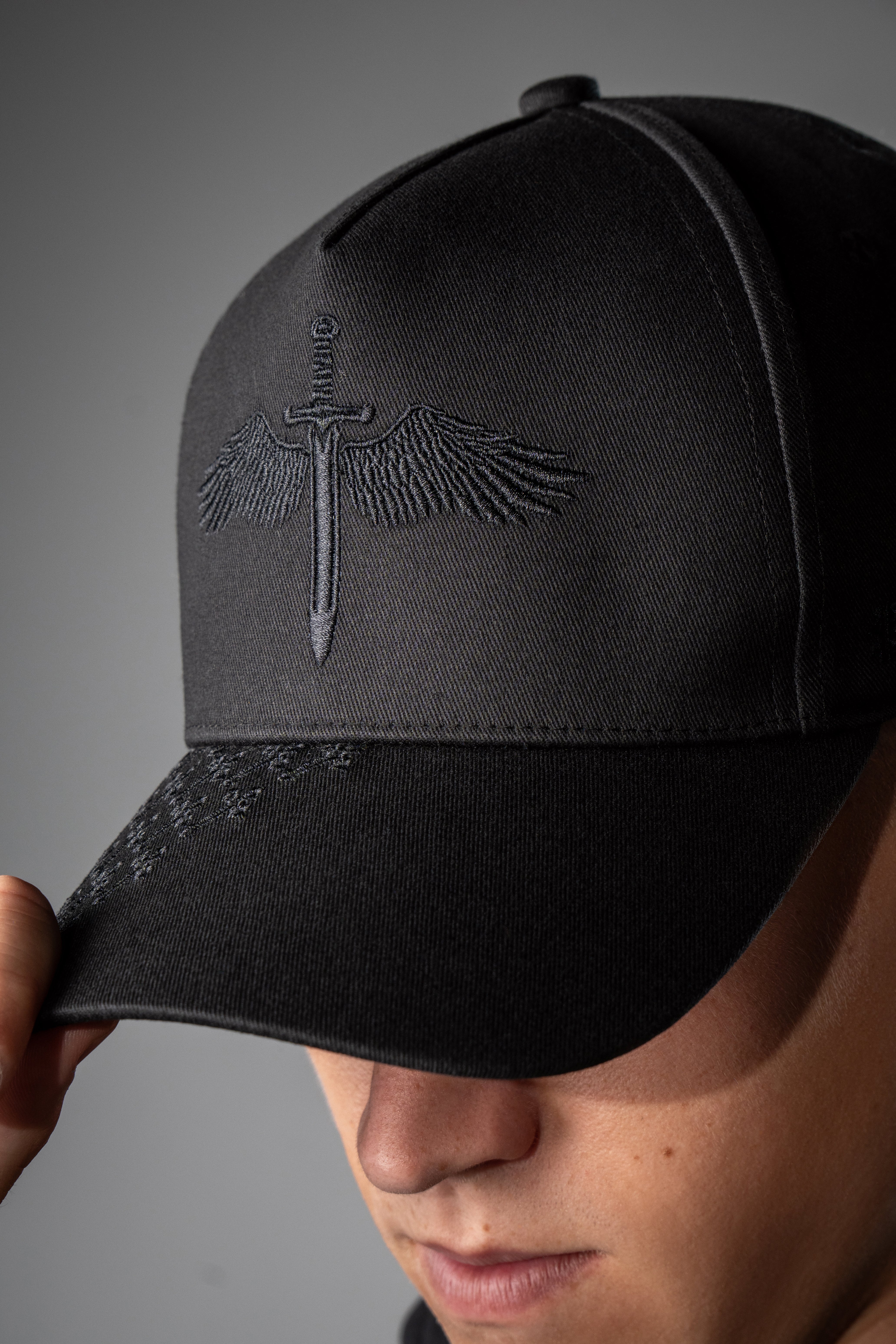 Saint Kaizen premium Christian gym wear Angel Wings Cap. Features bold spiritual Artwork, A comfortable cap designed for both the gym and casual wear.