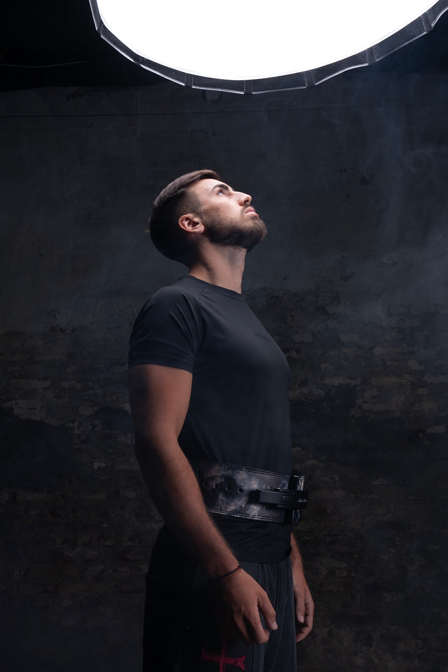 Christian athletes lifting heavy wearing the Saint Kaizen Archangel Gabriel Lever Belt. Ideal 10mm Weightlifting belt for Powerlifting and heavy training