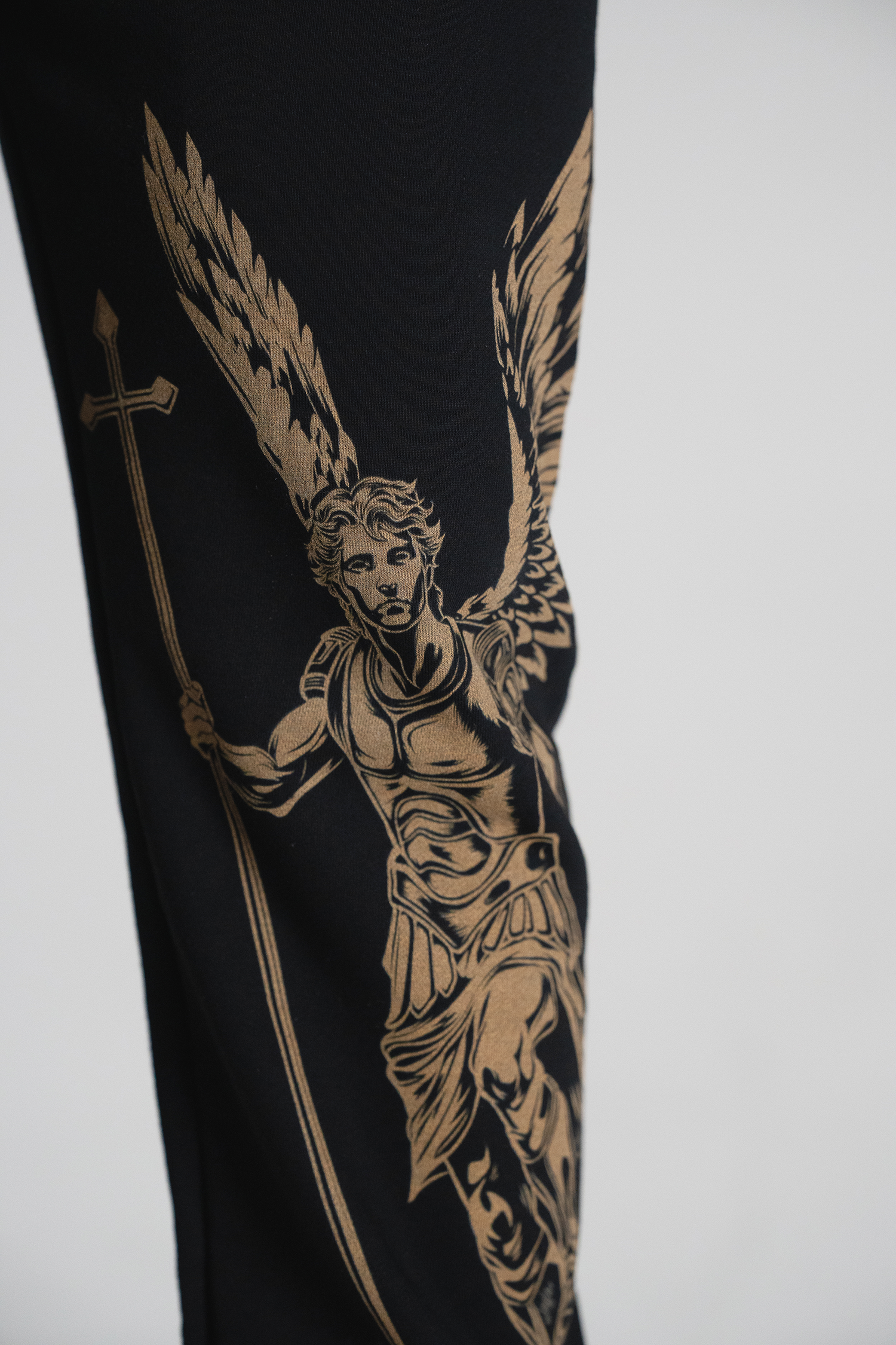 Saint Kaizen Archangel Michael Joggers. Christian gym wear with high-quality screen print design. Terry fleece lining for warmth and comfort.