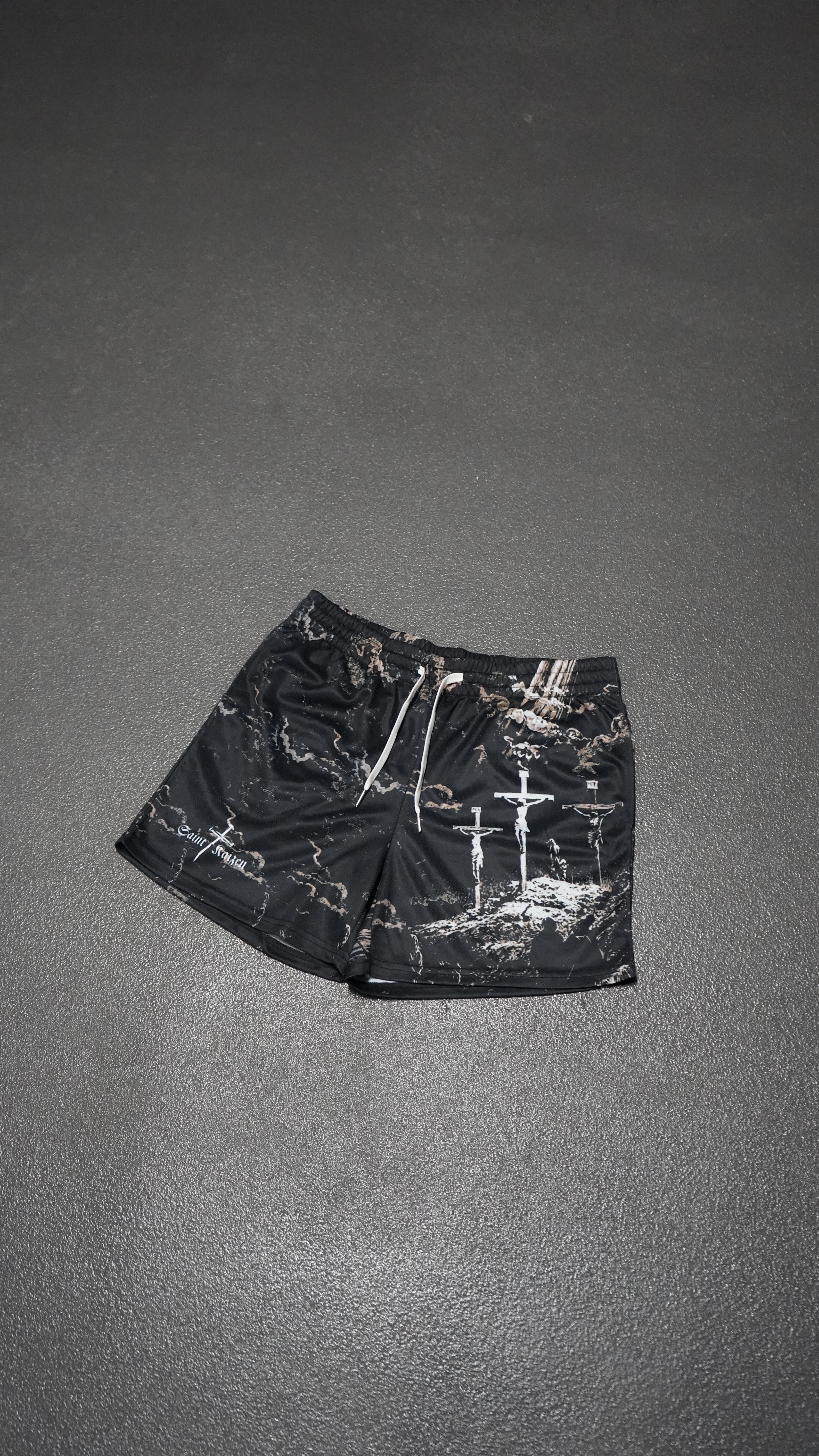 Saint Kaizen Christian gym wear Cross Camo Shorts. Lightweight 100% polyester mesh with bold printed spiritual design. Features a 5-inch inseam for mobility.