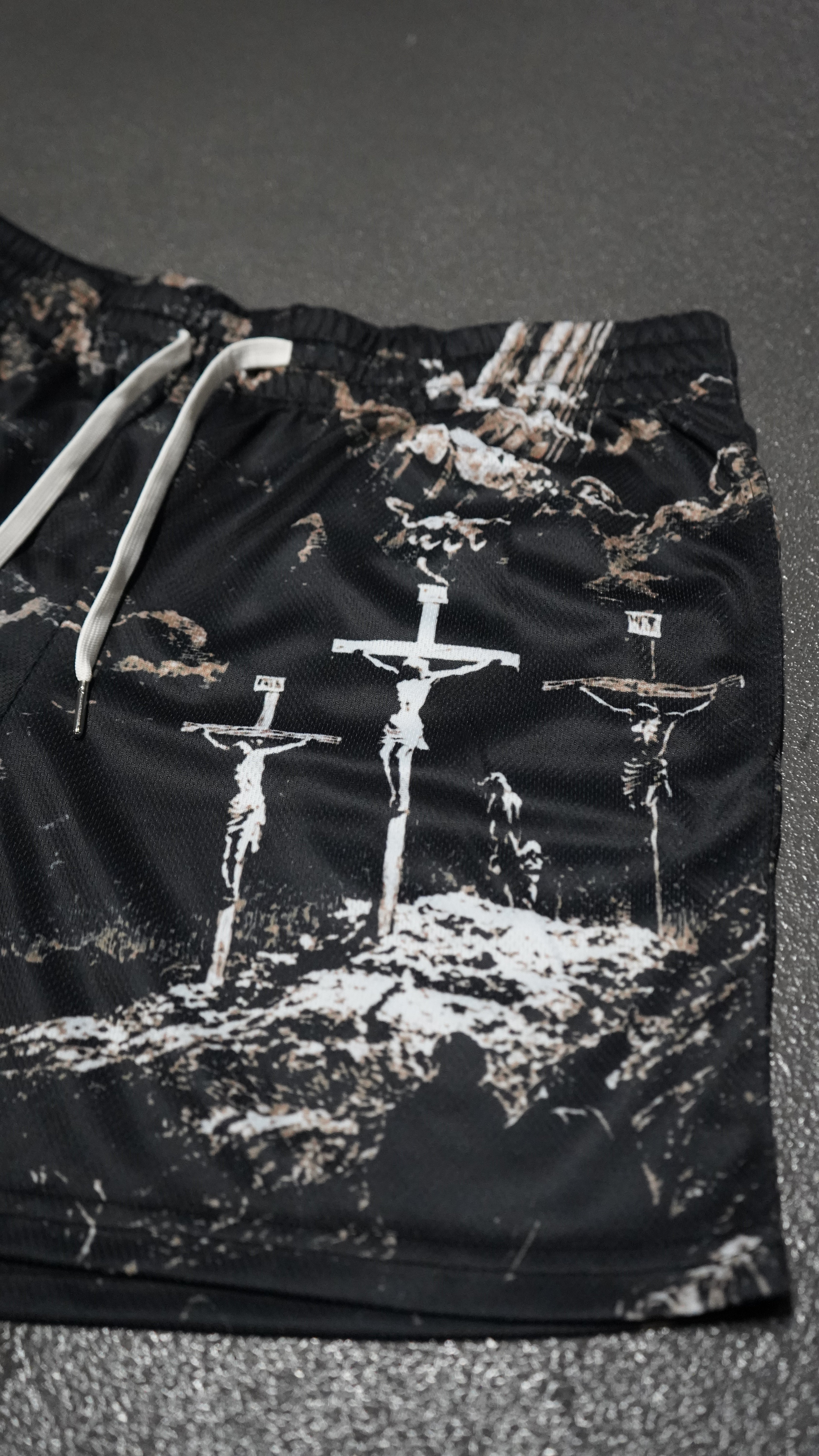 Saint Kaizen Christian gym wear Cross Camo Shorts. Lightweight 100% polyester mesh with bold printed spiritual design. Features a 5-inch inseam for mobility.