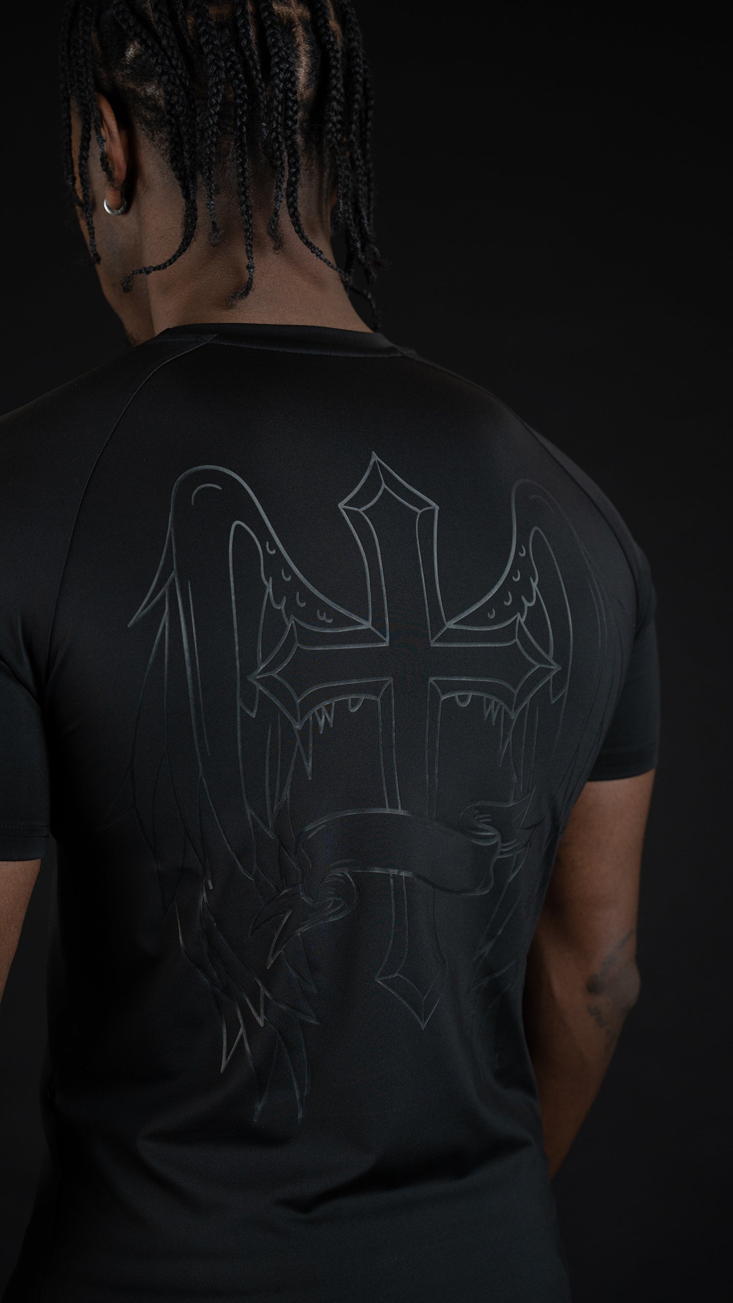 Saint Kaizen Cross Wings Compression Tee. High-performance Christian gym wear with printed spiritual artwork. Tailored, ergonomic fit for muscle support.