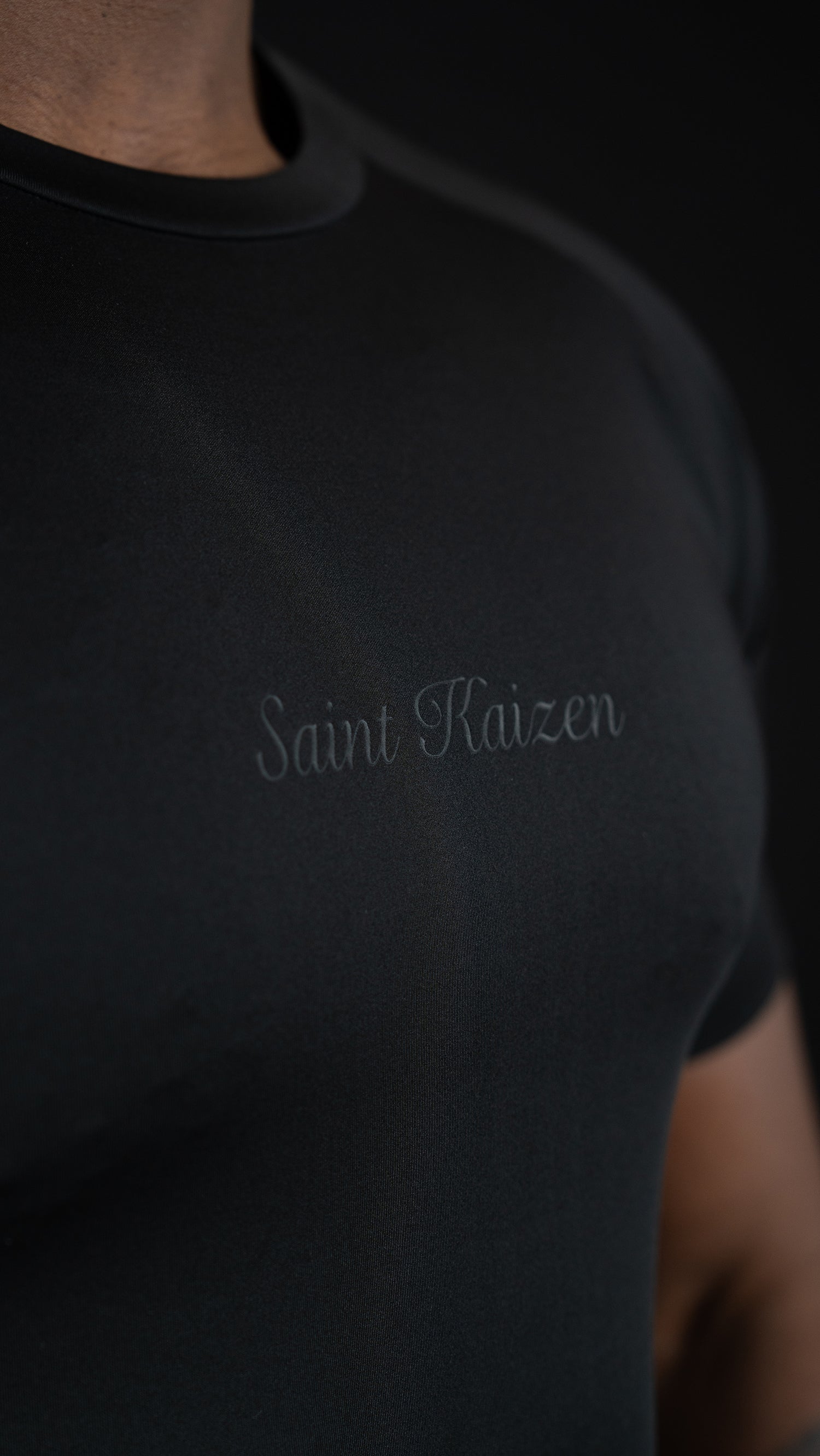Saint Kaizen Cross Wings Compression Tee. High-performance Christian gym wear with printed spiritual artwork. Tailored, ergonomic fit for muscle support.