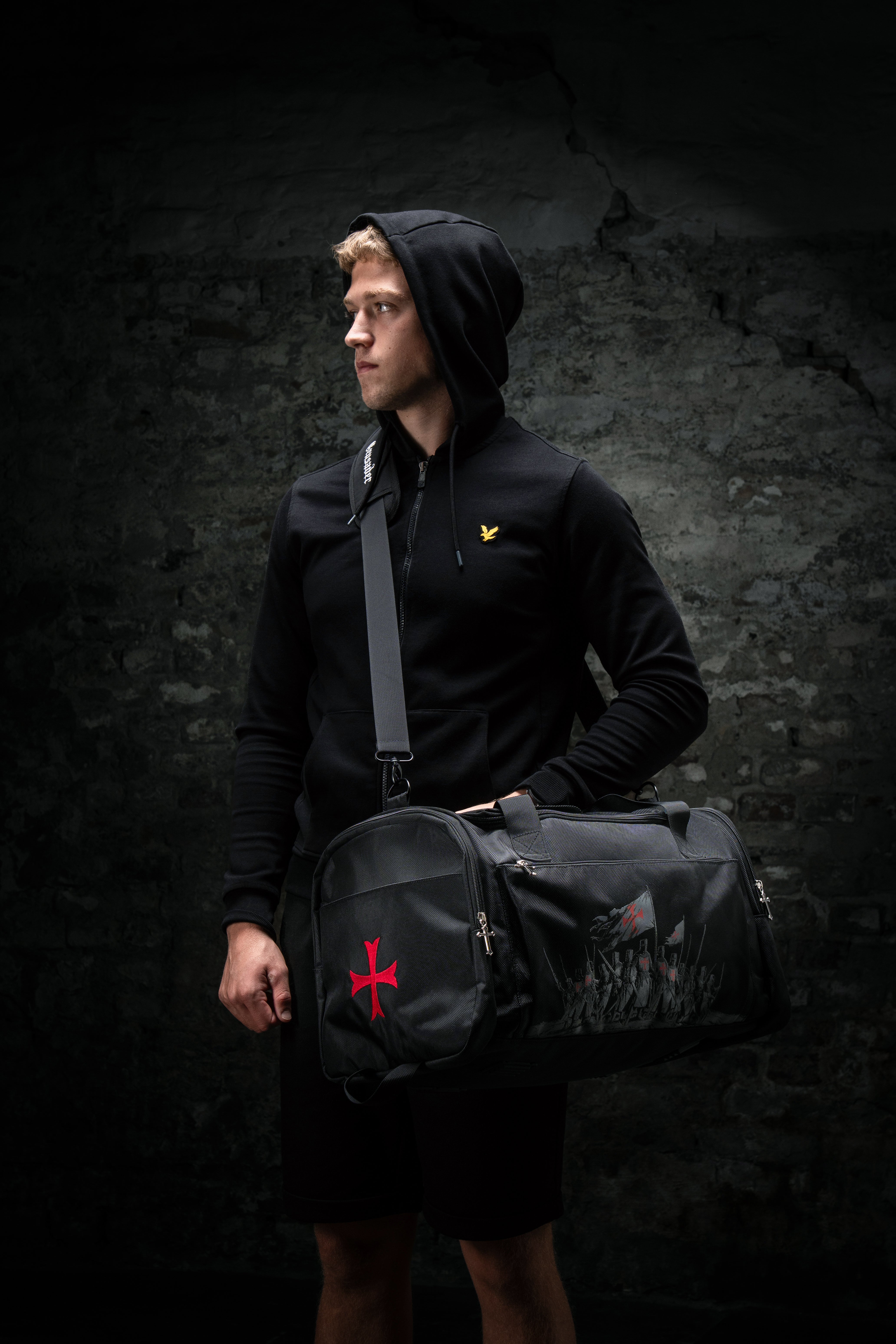 Saint Kaizen Christian gym duffle bag. Features the Crusader Duffle Bag verse, powerful spiritual silk print artwork, and detailed embroidery for Christian athletes