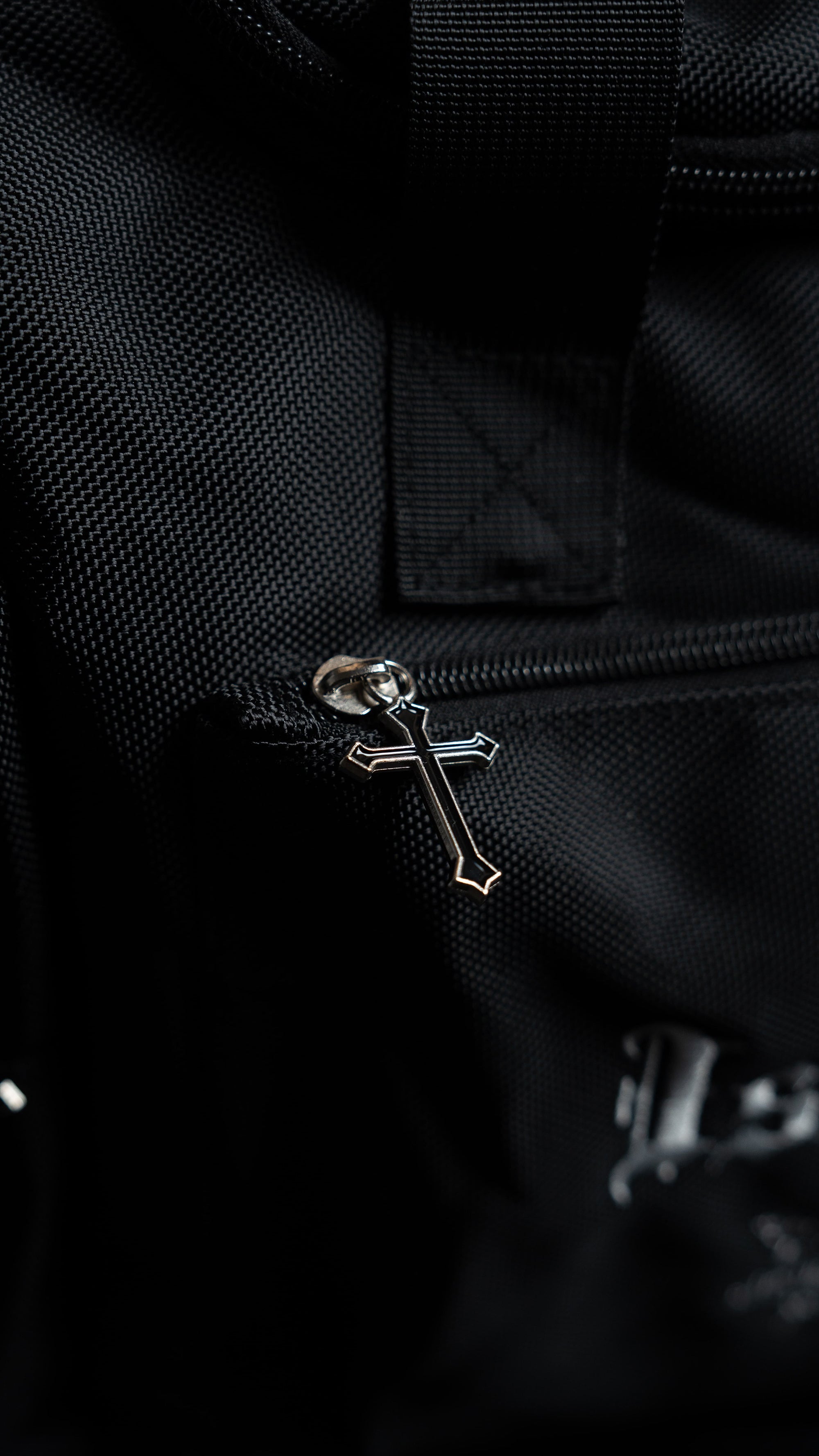 Detailed view of the custom cross zippers on the Saint Kaizen Fear Not Duffle Bag. Premium quality duffle bag designed specifically for Christian athletes.