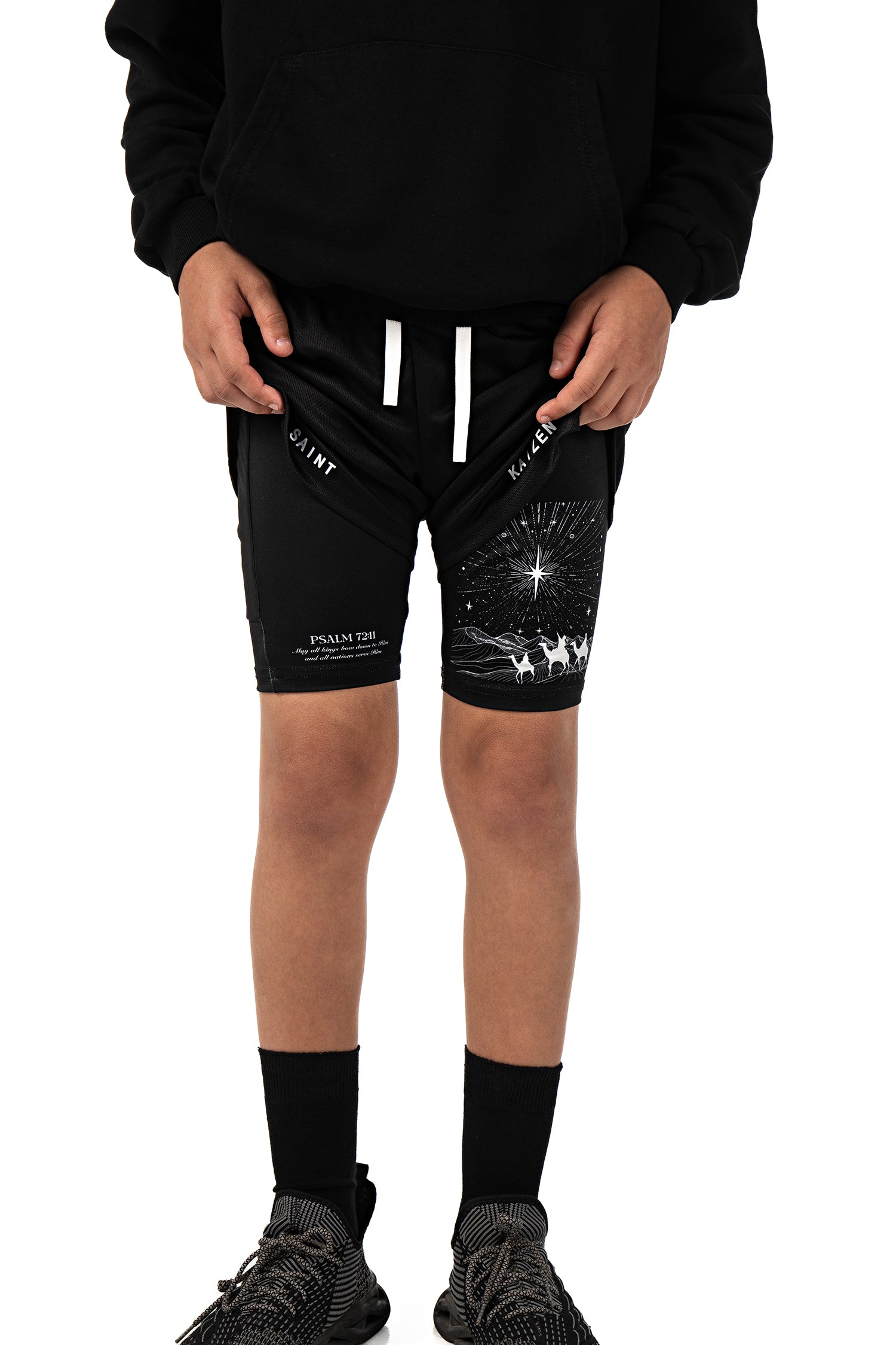 Saint Kaizen Christian gym wear Guiding Light Youth Performance Shorts. Two-layer shorts built for optimal mobility, featuring secure pockets and premium fabric.