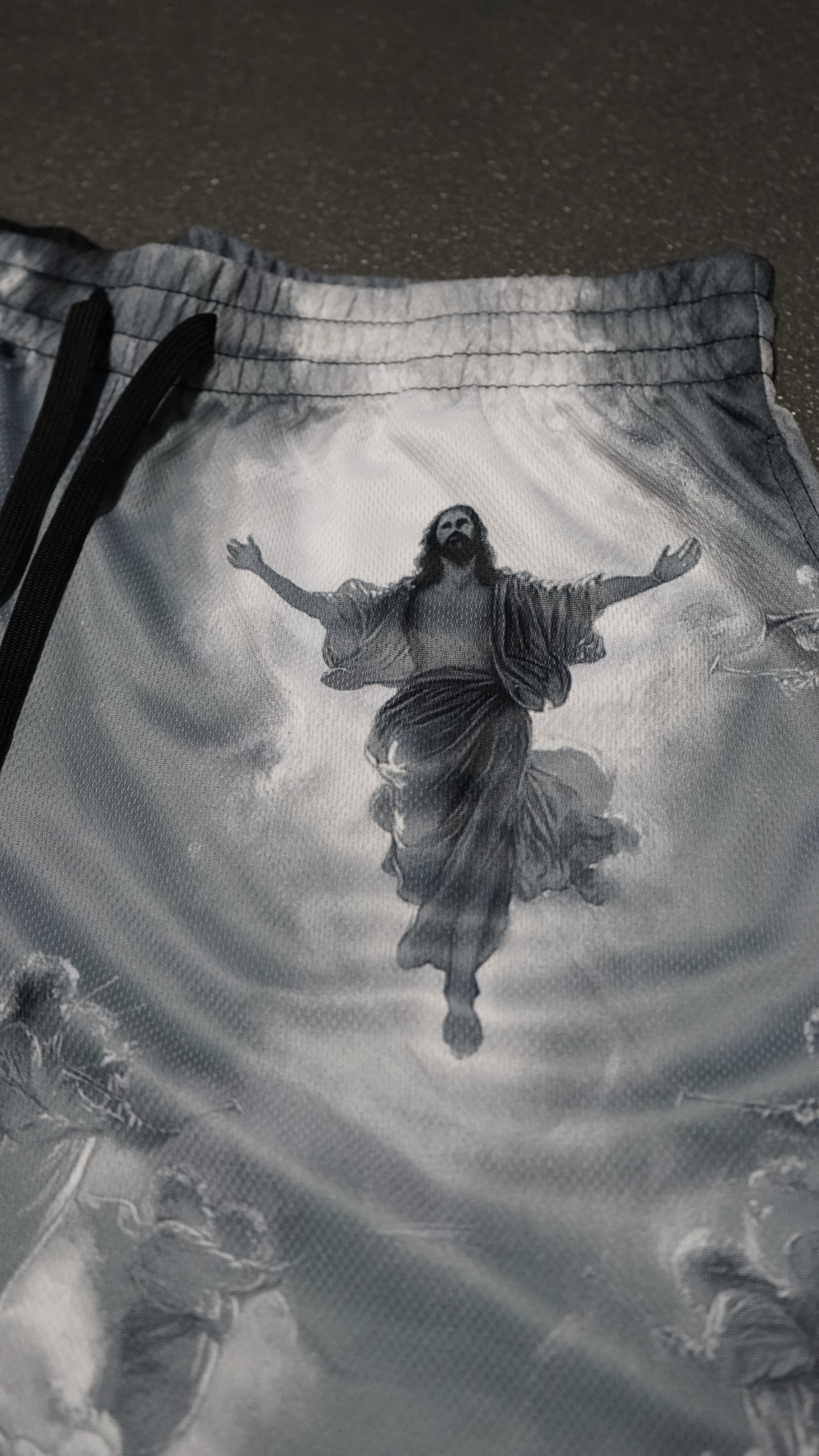 Saint Kaizen Christian gym wear Saviour Shorts. Lightweight 100% polyester mesh with bold printed spiritual design. Features a 5-inch inseam for mobility.