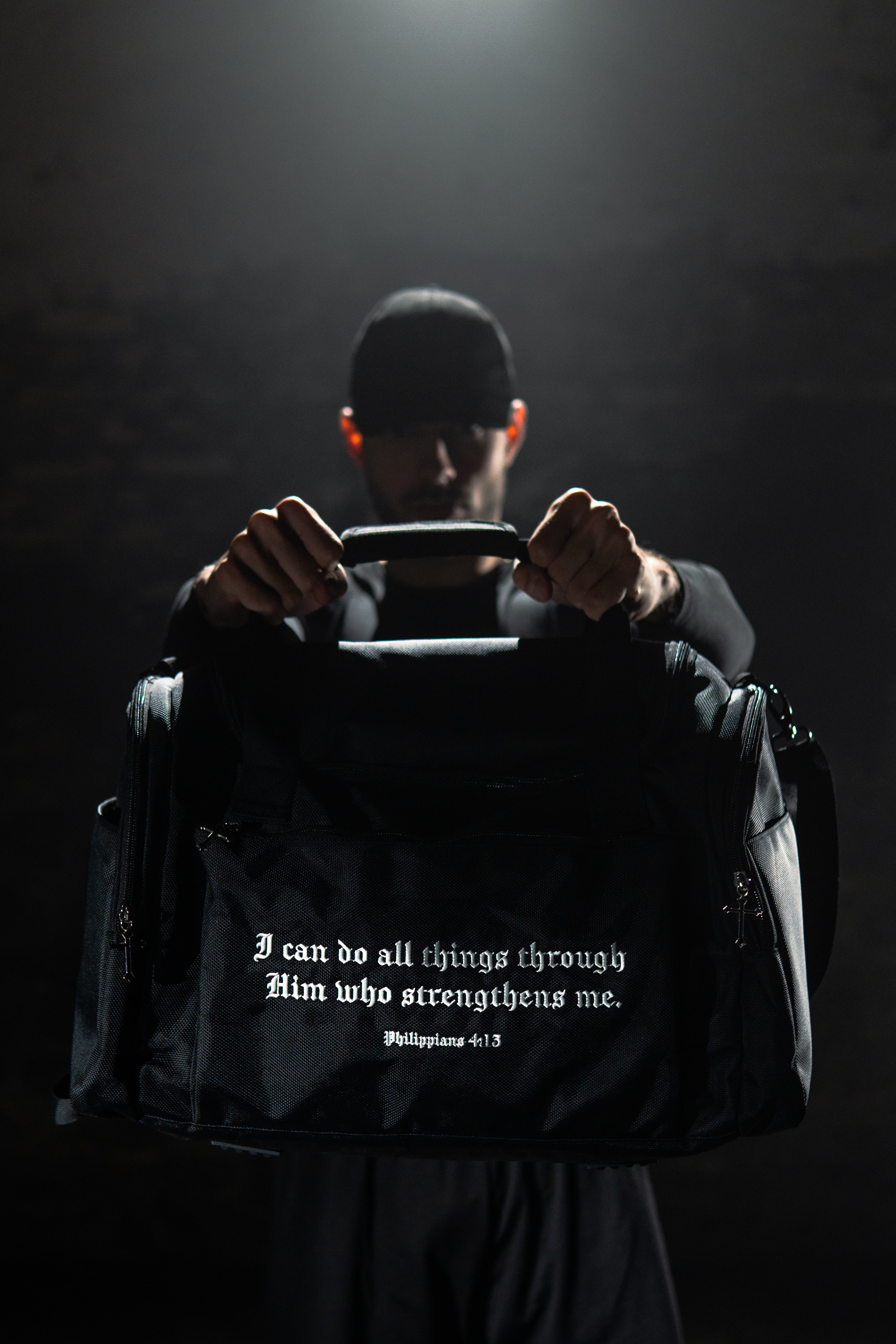 Saint Kaizen Christian gym duffle bag. Features the Soldier of God Duffle Bag verse, powerful spiritual artwork, and detailed embroidery for Christian athletes.