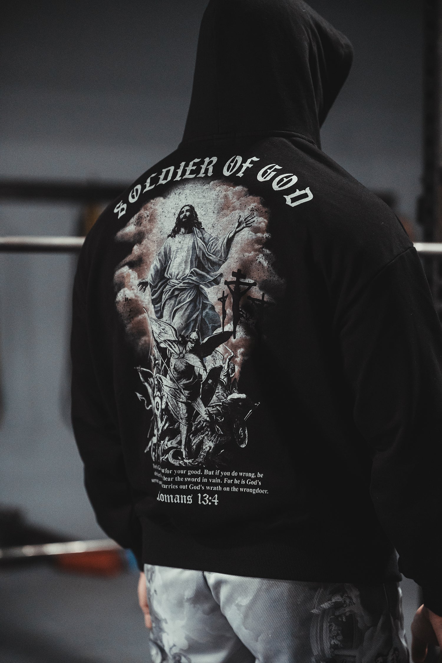 Saint Kaizen Soldier of God Hoodie Black. Heavyweight Christian gym wear hoodie featuring a durable with spiritual artwork.
