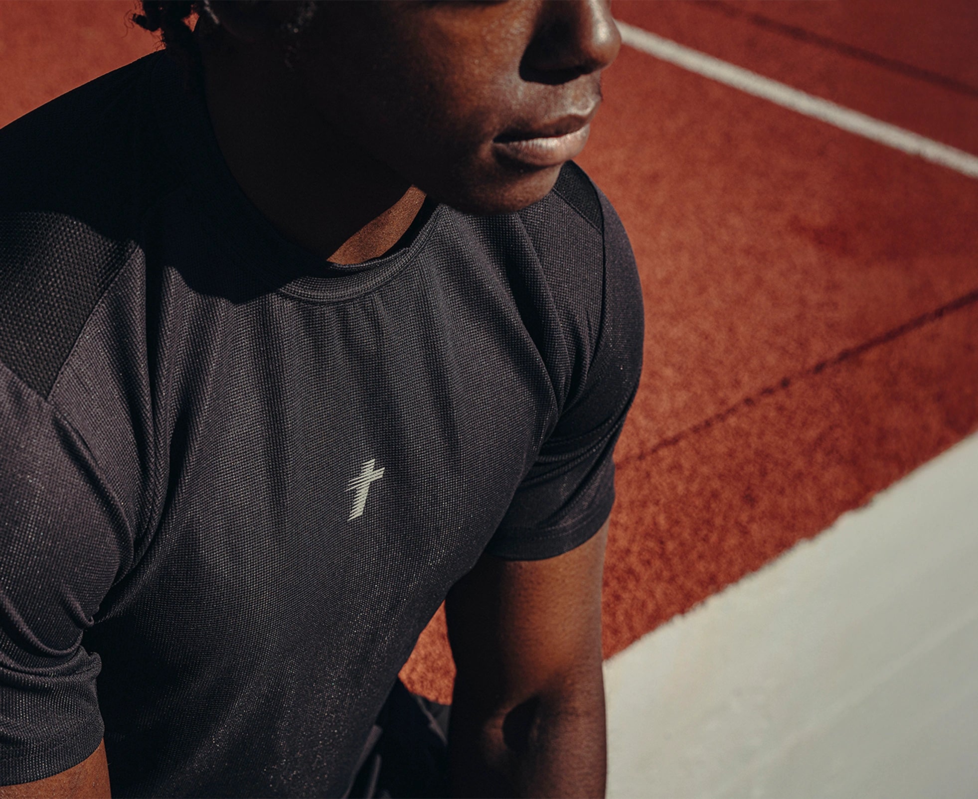 Philippians 4:13 performance tee on the running track