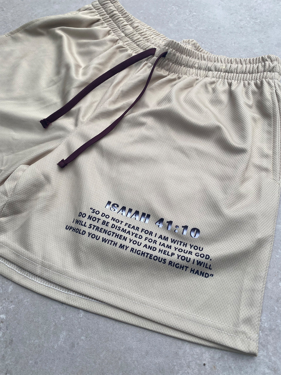 Christian-themed mesh gym shorts with Bible verses, made from 100% polyester, featuring double side pockets and a 5-inch inseam for comfort and mobility.
