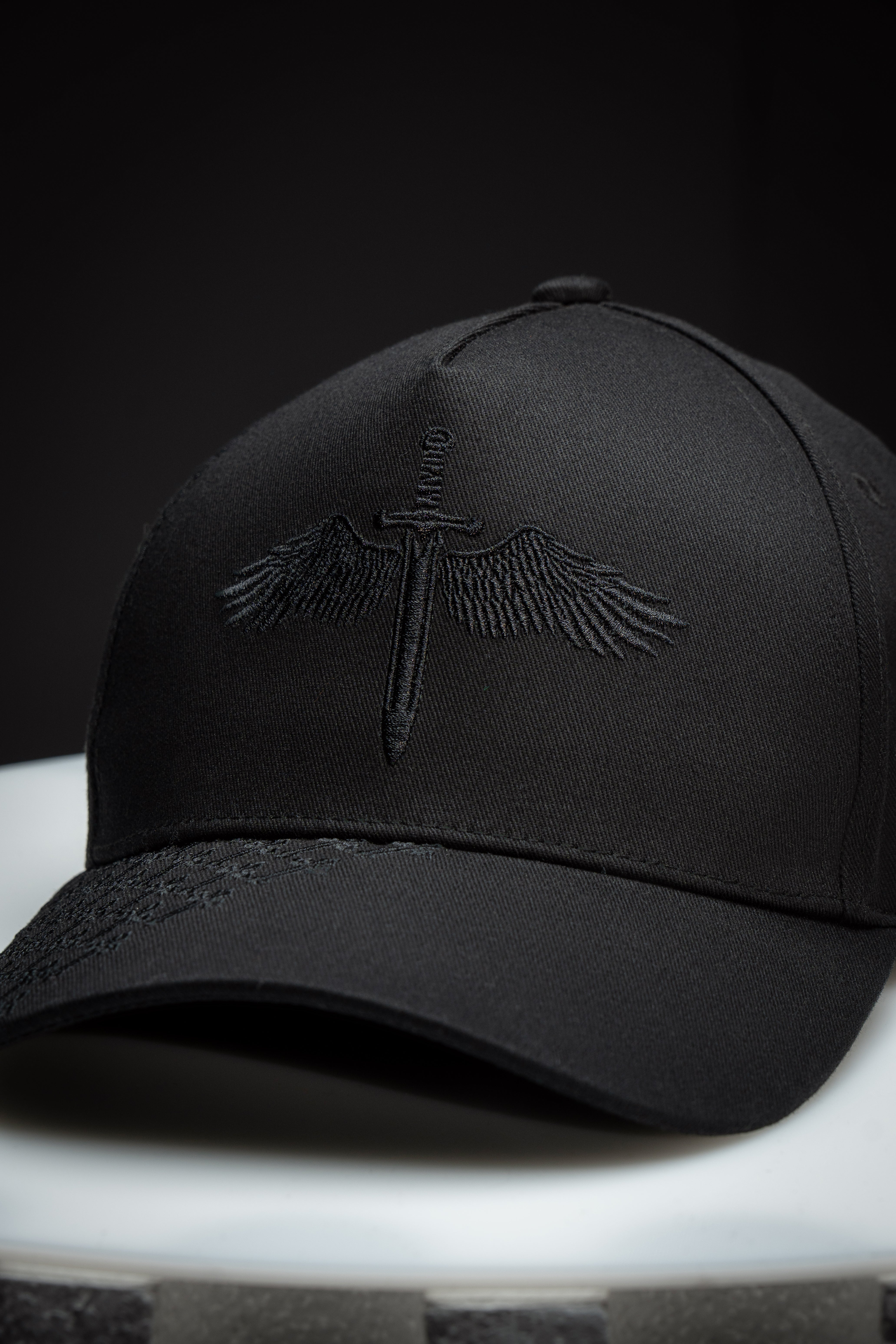 Saint Kaizen premium Christian gym wear Angel Wings Cap. Features bold spiritual Artwork, A comfortable cap designed for both the gym and casual wear.