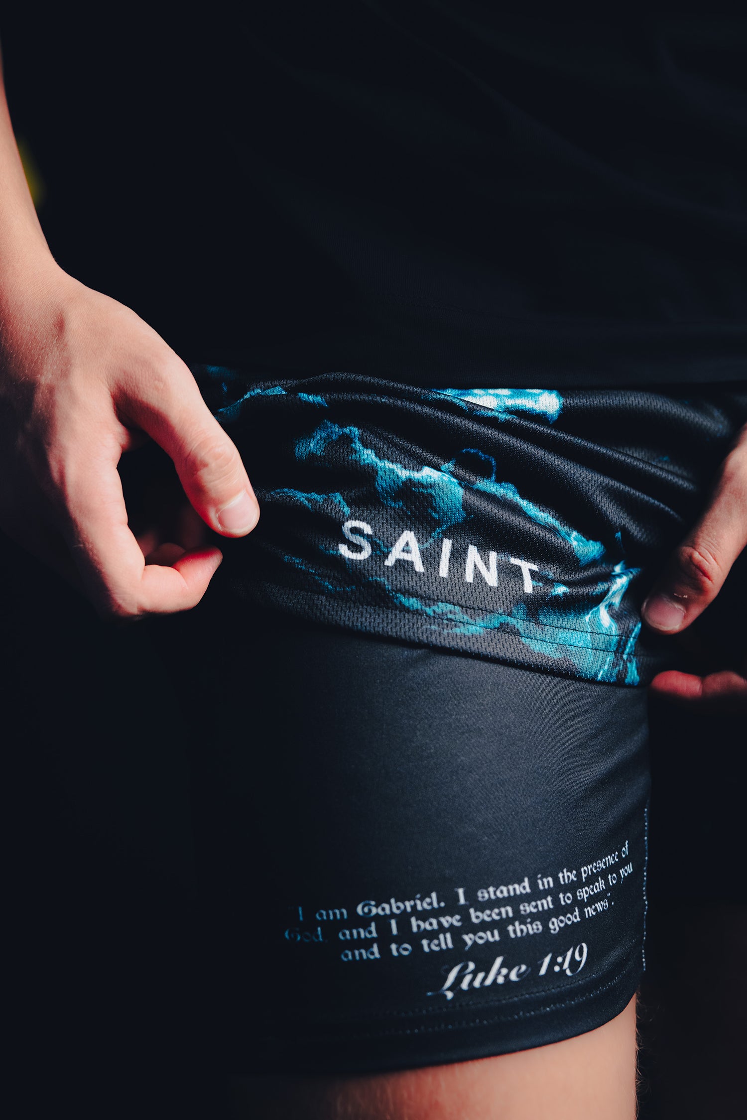 Saint Kaizen Christian gym wear Archangel Gabriel Performance Shorts. Two-layer shorts built for optimal mobility, featuring secure pockets and premium fabric.