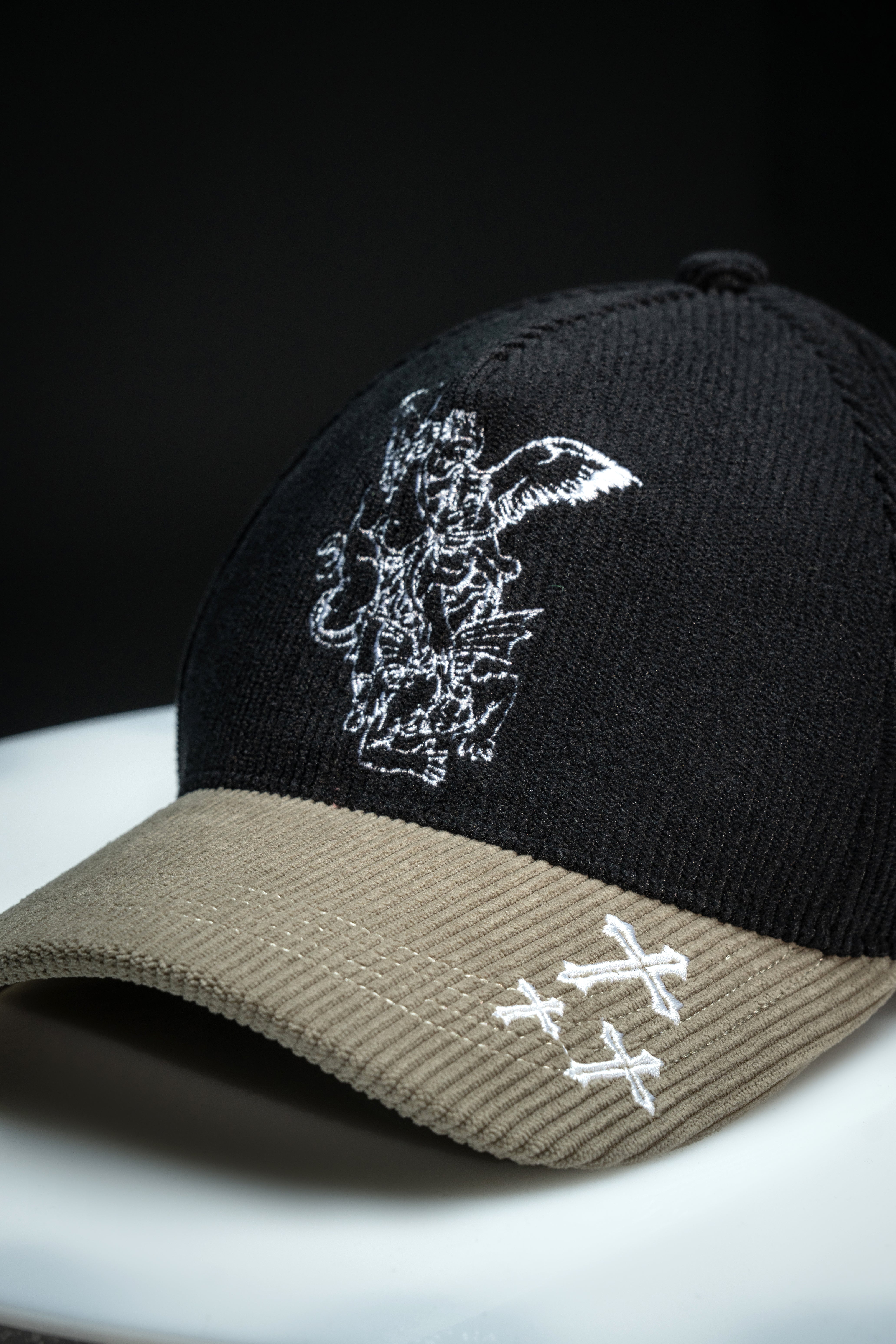 Saint Kaizen premium Christian gym wear [Archangel Michael Cap - Black and Cream]. Features bold spiritual Artwork, A comfortable cap designed for both the gym and casual wear.