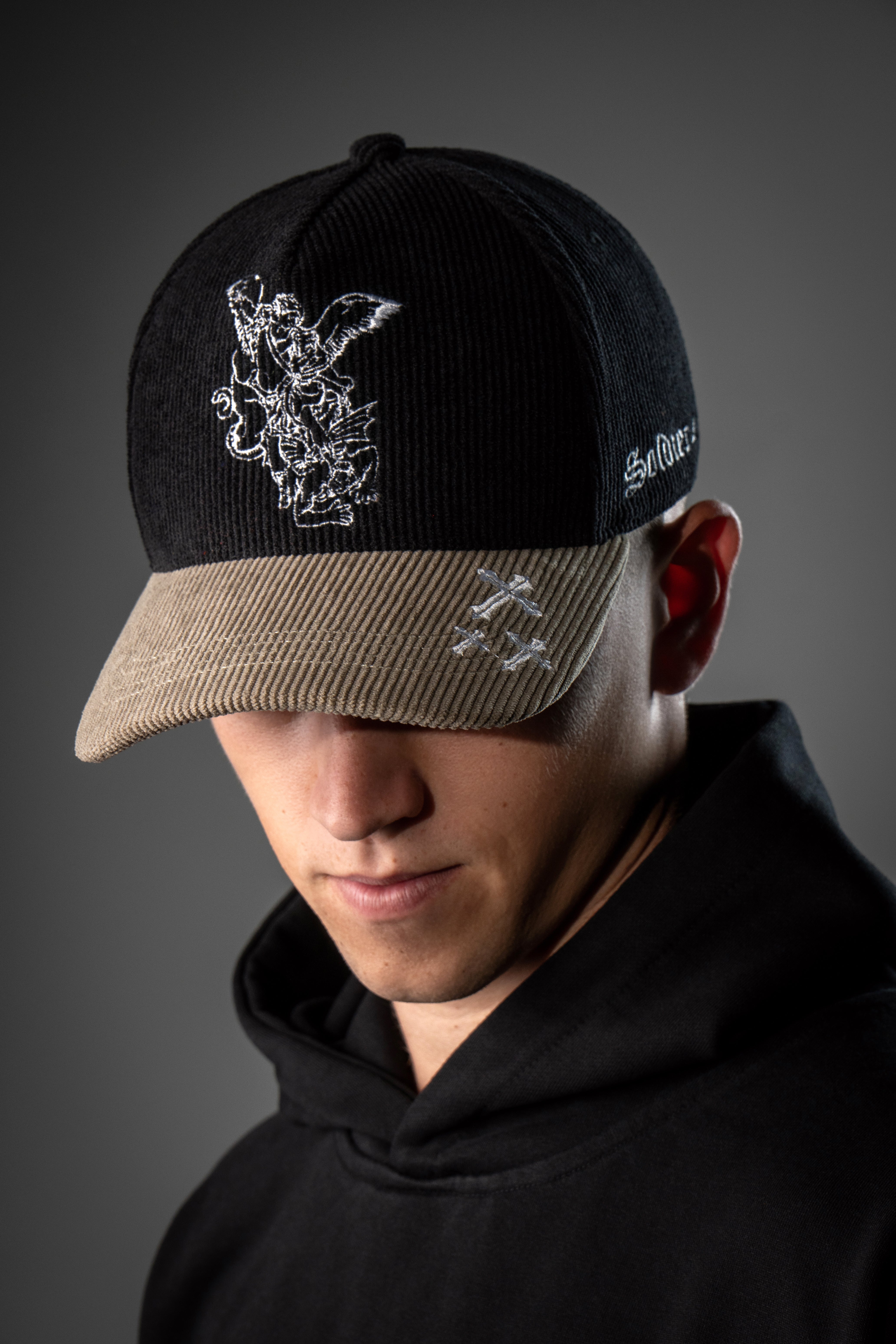 Saint Kaizen premium Christian gym wear [Archangel Michael Cap - Black and Cream]. Features bold spiritual Artwork, A comfortable cap designed for both the gym and casual wear.