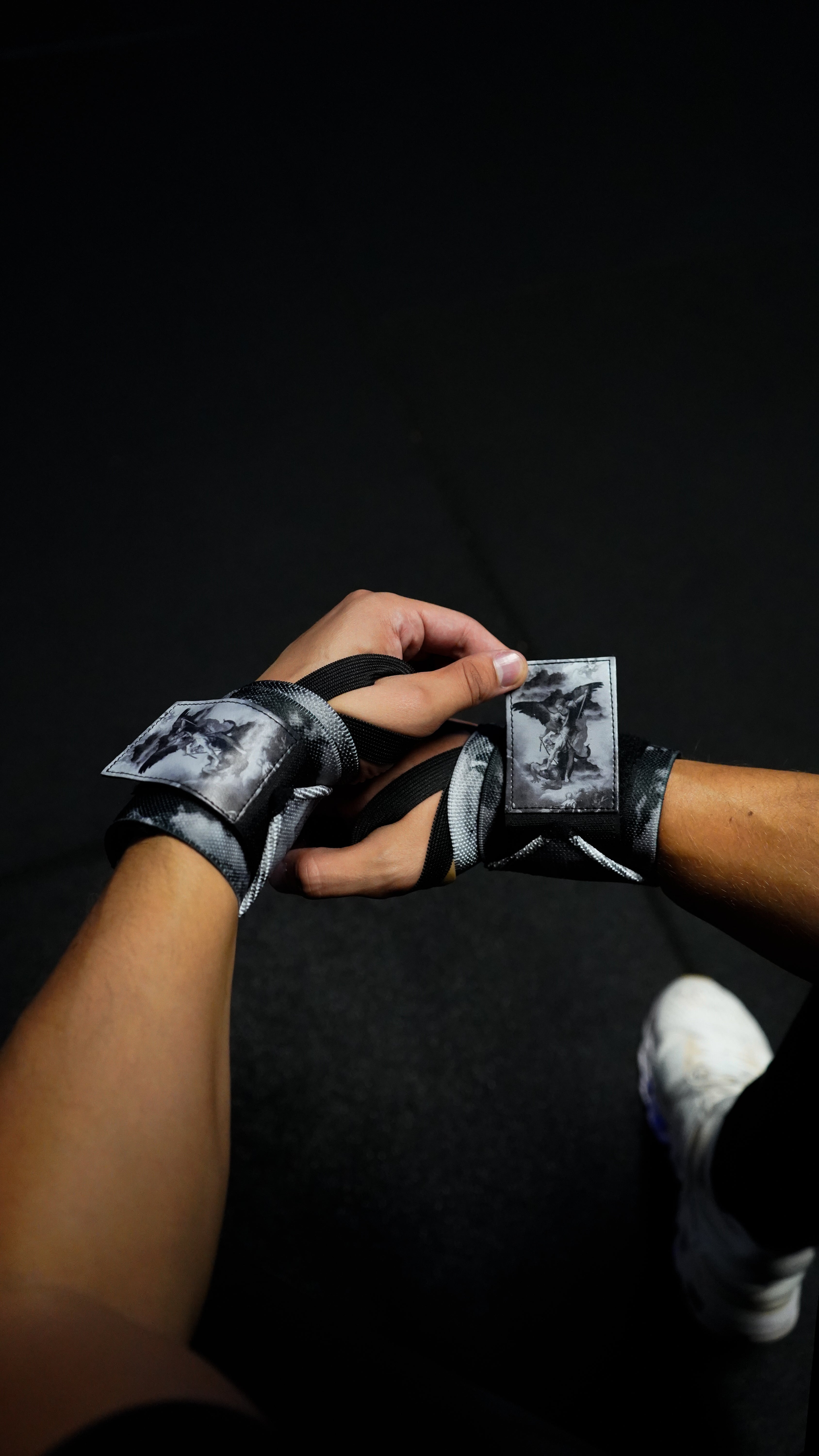 Saint Kaizen Archangel Michael Wrist Wraps - V2. Christian gym wear accessory featuring bold spiritual print and heavy-duty Velcro for stability.