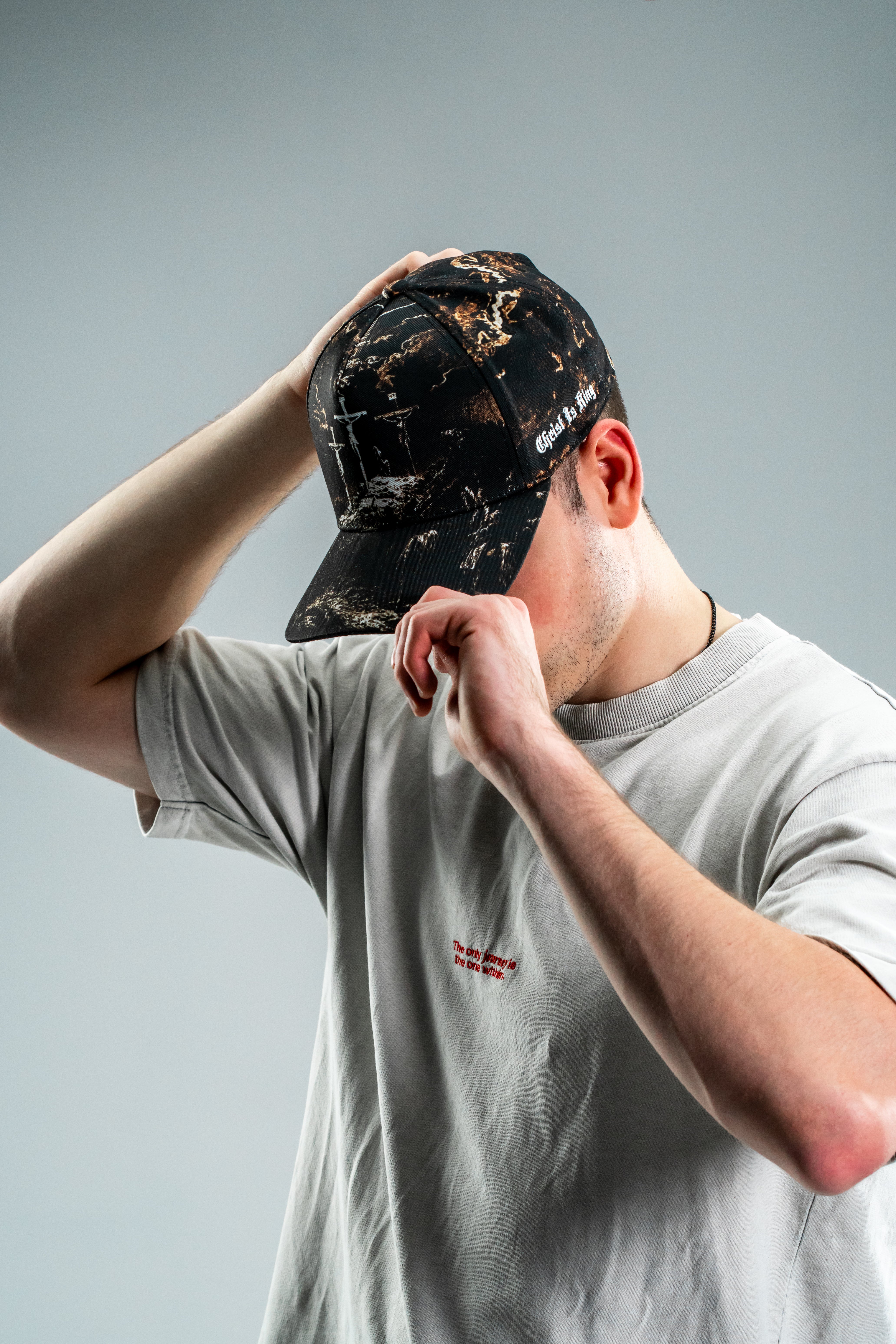 Saint Kaizen premium Christian gym wear [Cross Camo Cap]. Features bold spiritual Artwork, A comfortable cap designed for both the gym and casual wear.