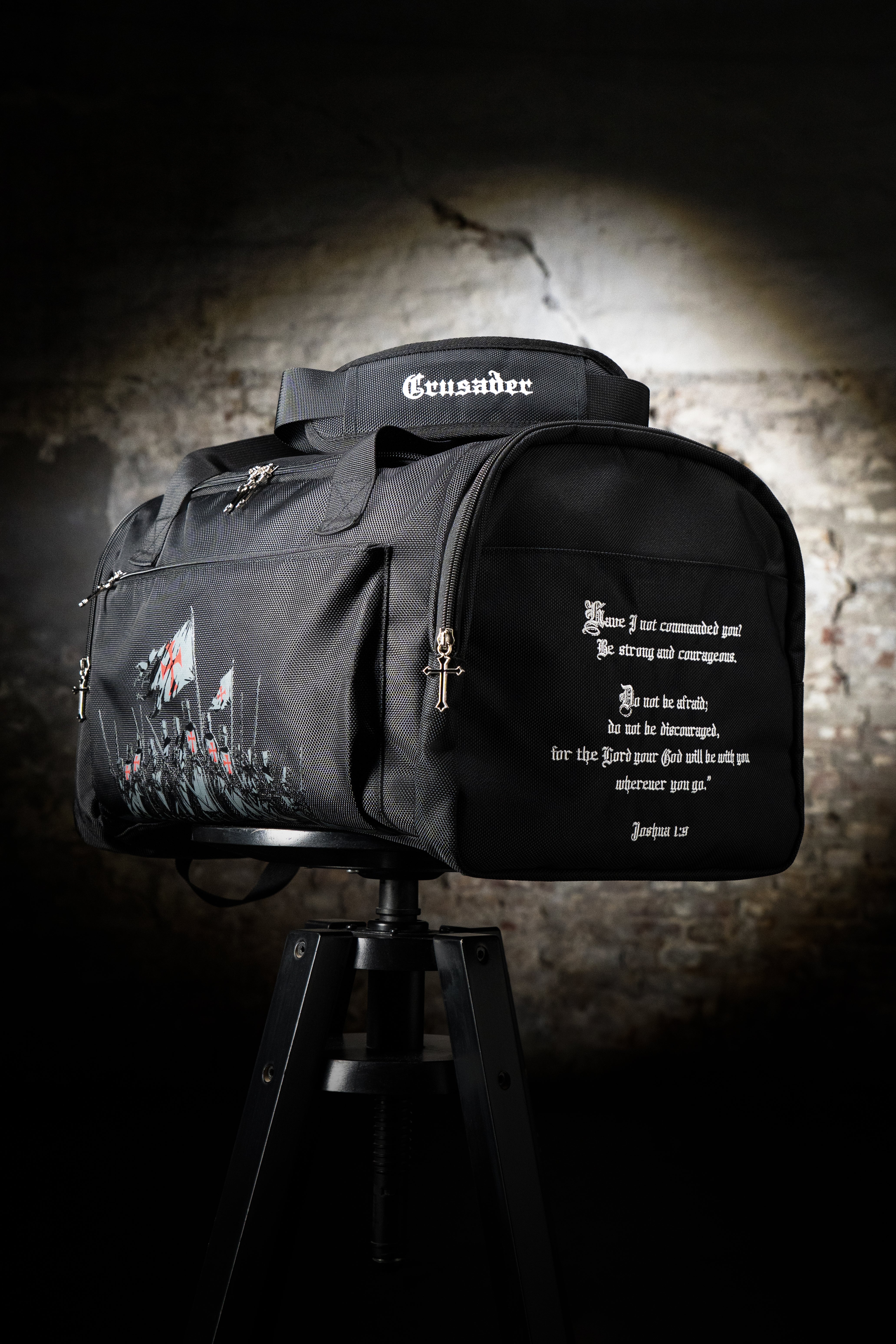 Saint Kaizen Christian gym duffle bag. Features the Crusader Duffle Bag verse, powerful spiritual silk print artwork, and detailed embroidery for Christian athletes