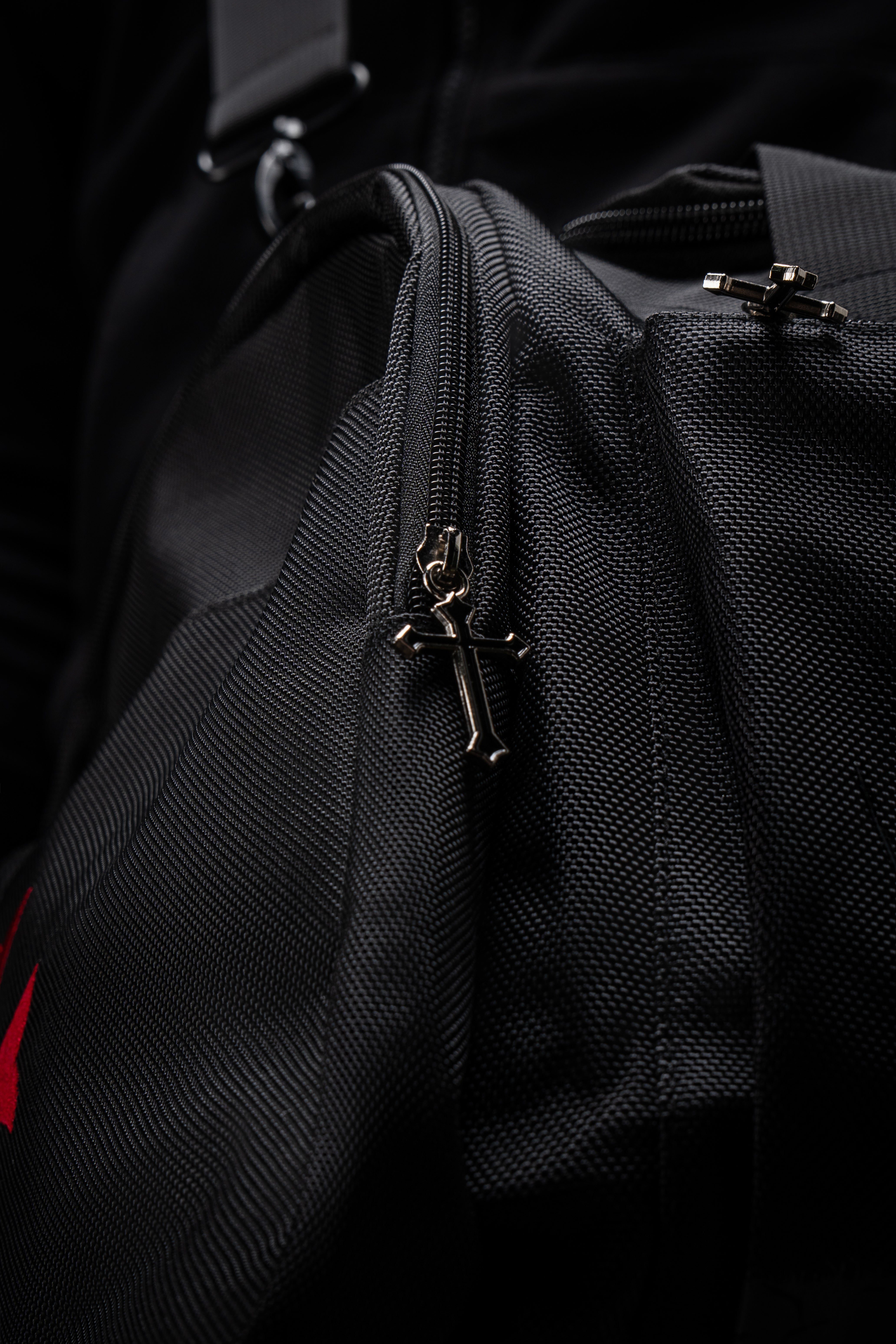 Detailed view of the custom cross zippers on the Saint Kaizen Crusader Duffle Bag. Premium quality duffle bag designed specifically for Christian athletes.