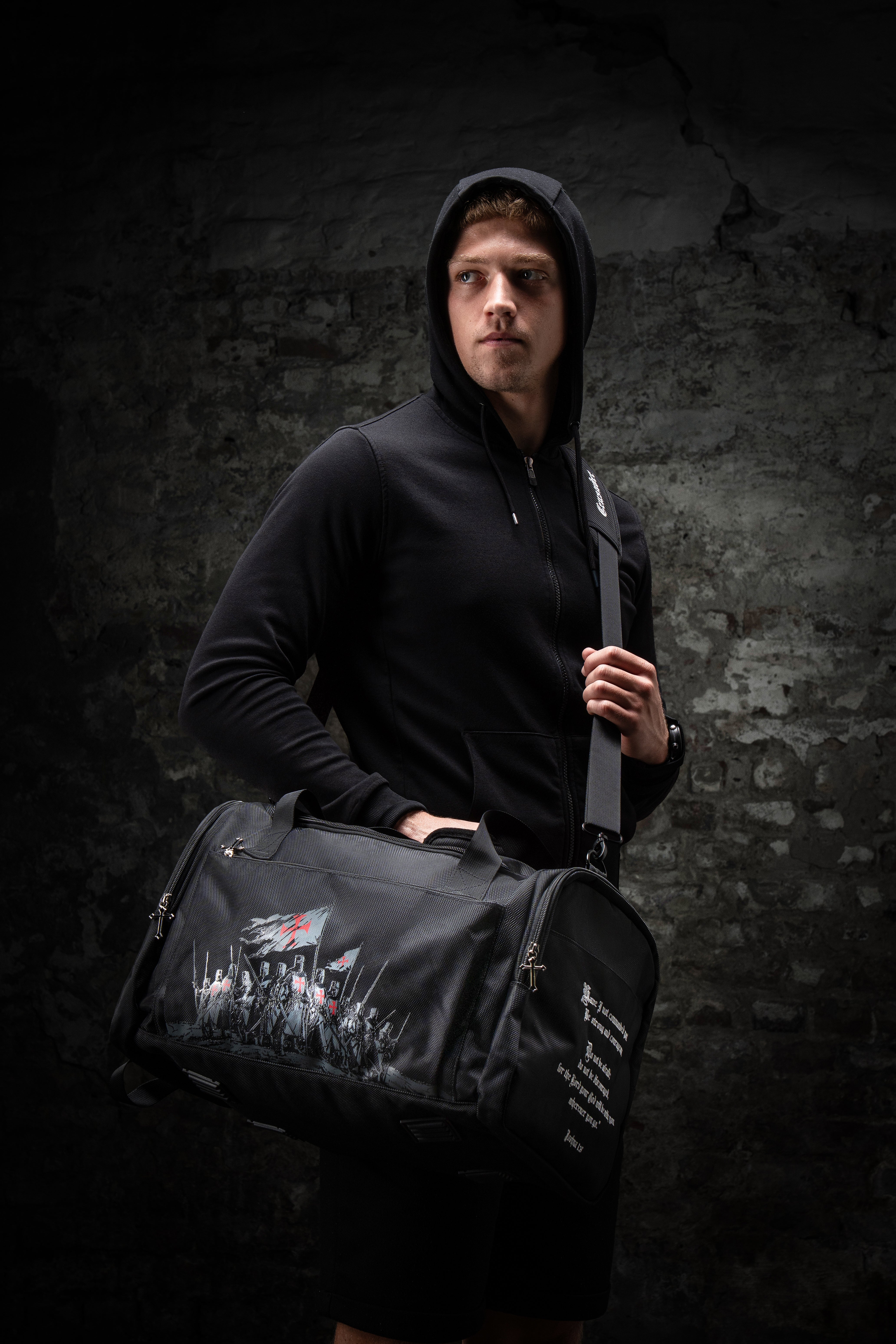 Saint Kaizen Christian gym duffle bag. Features the Crusader Duffle Bag verse, powerful spiritual silk print artwork, and detailed embroidery for Christian athletes