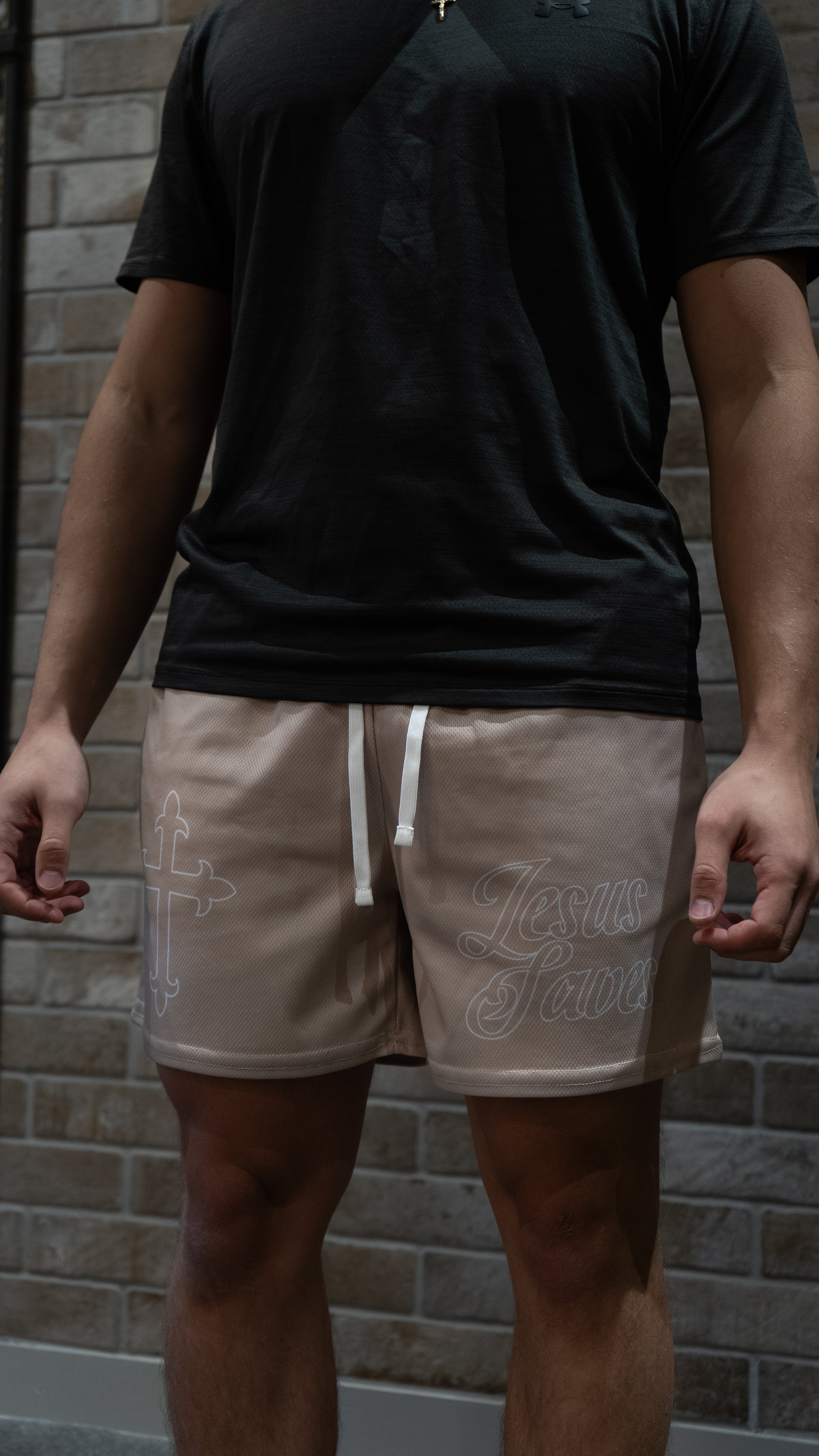 Christian-themed mesh gym shorts with Bible verses, made from 100% polyester, featuring double side pockets and a 5-inch inseam for comfort and mobility.