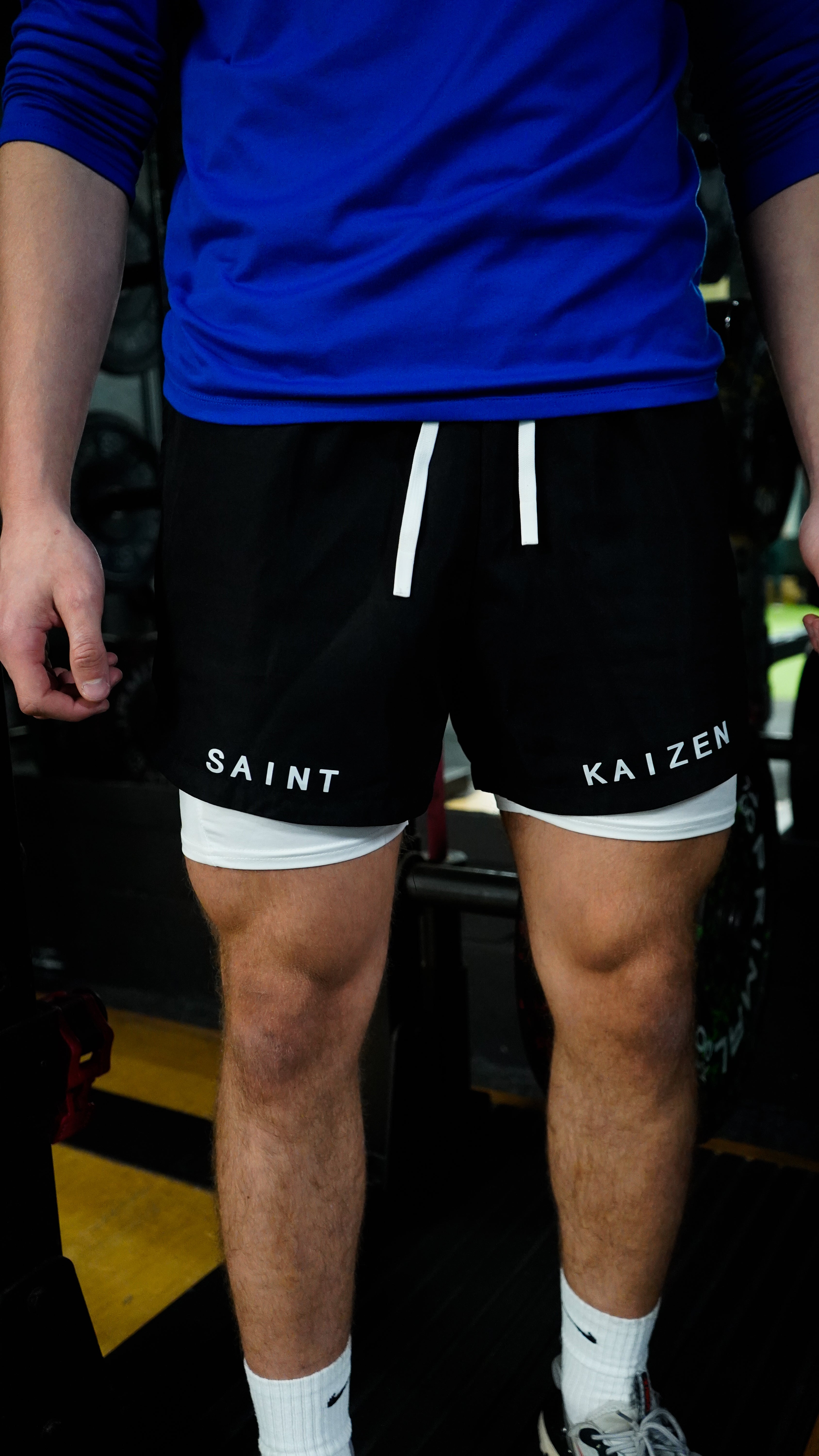 Christian-themed performance shorts with Bible verses, made from a blend of cotton and polyester with a spandex inner lining, featuring Saint Kaizen screen print and multiple pockets for convenience.