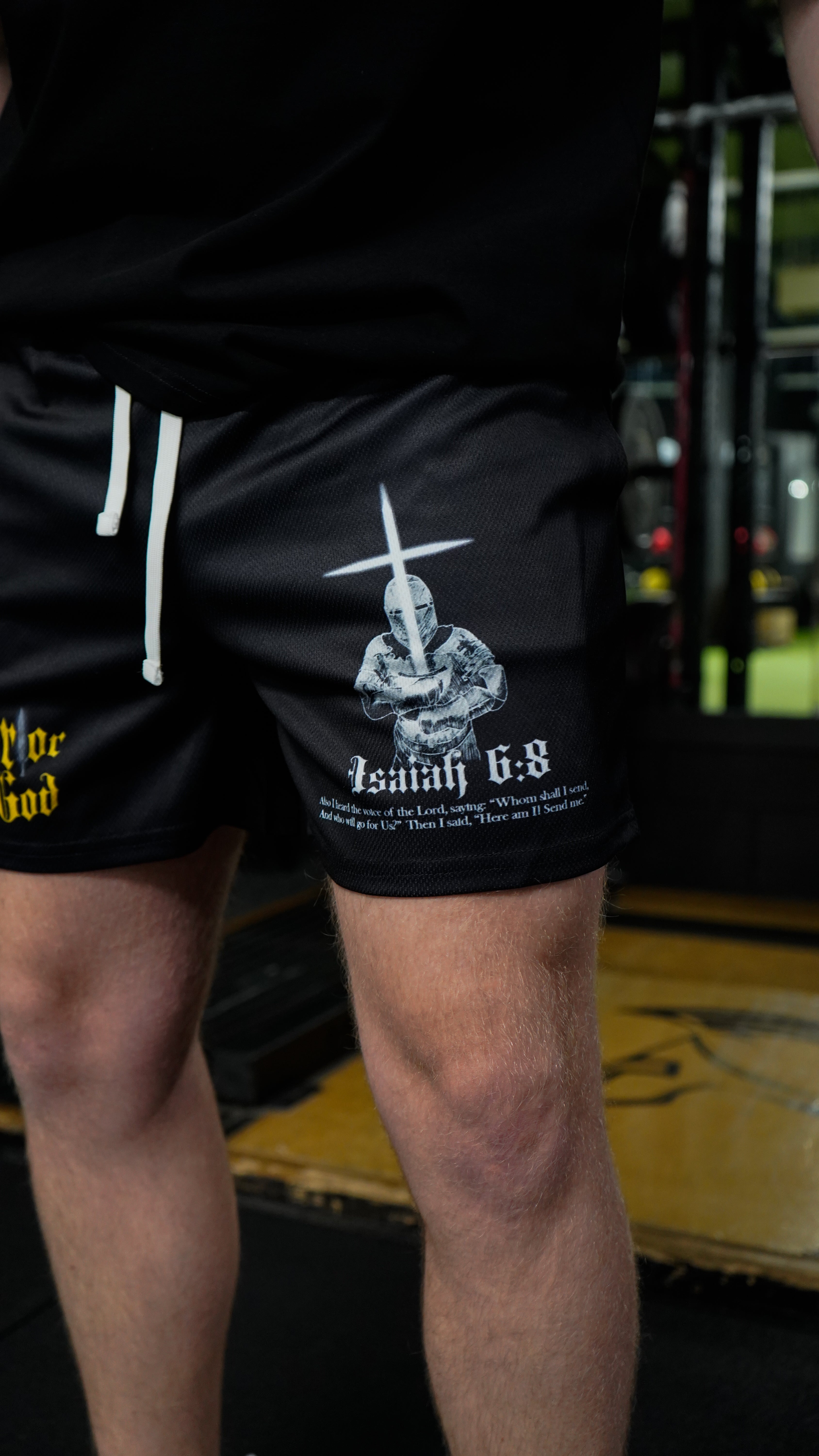 Christian-themed mesh gym shorts with Bible verses, made from 100% polyester, featuring double side pockets and a 5-inch inseam for comfort and mobility.