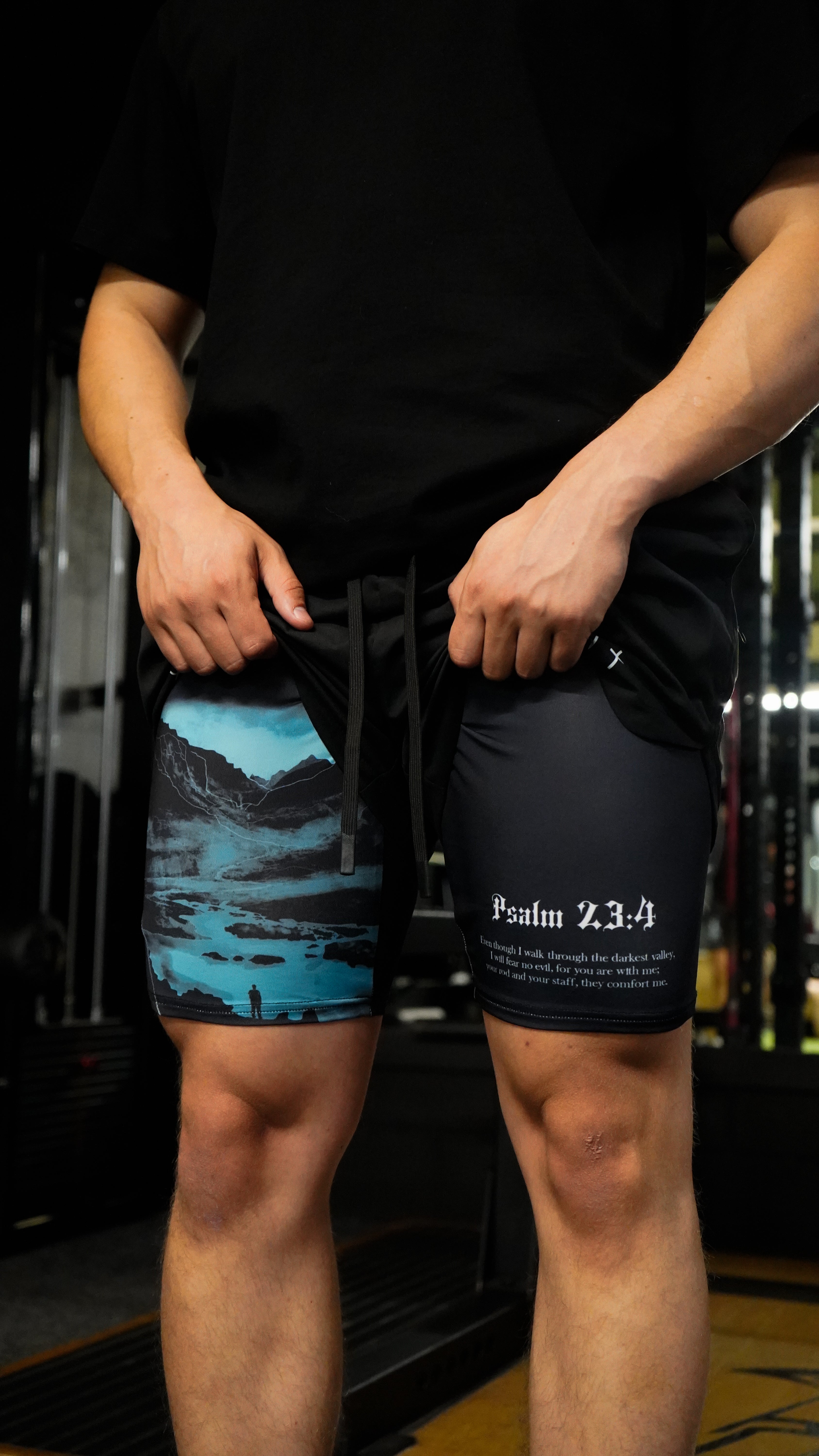 Christian-themed performance shorts with Bible verses, made from a blend of cotton and polyester with a spandex inner lining, featuring Saint Kaizen screen print and multiple pockets for convenience.