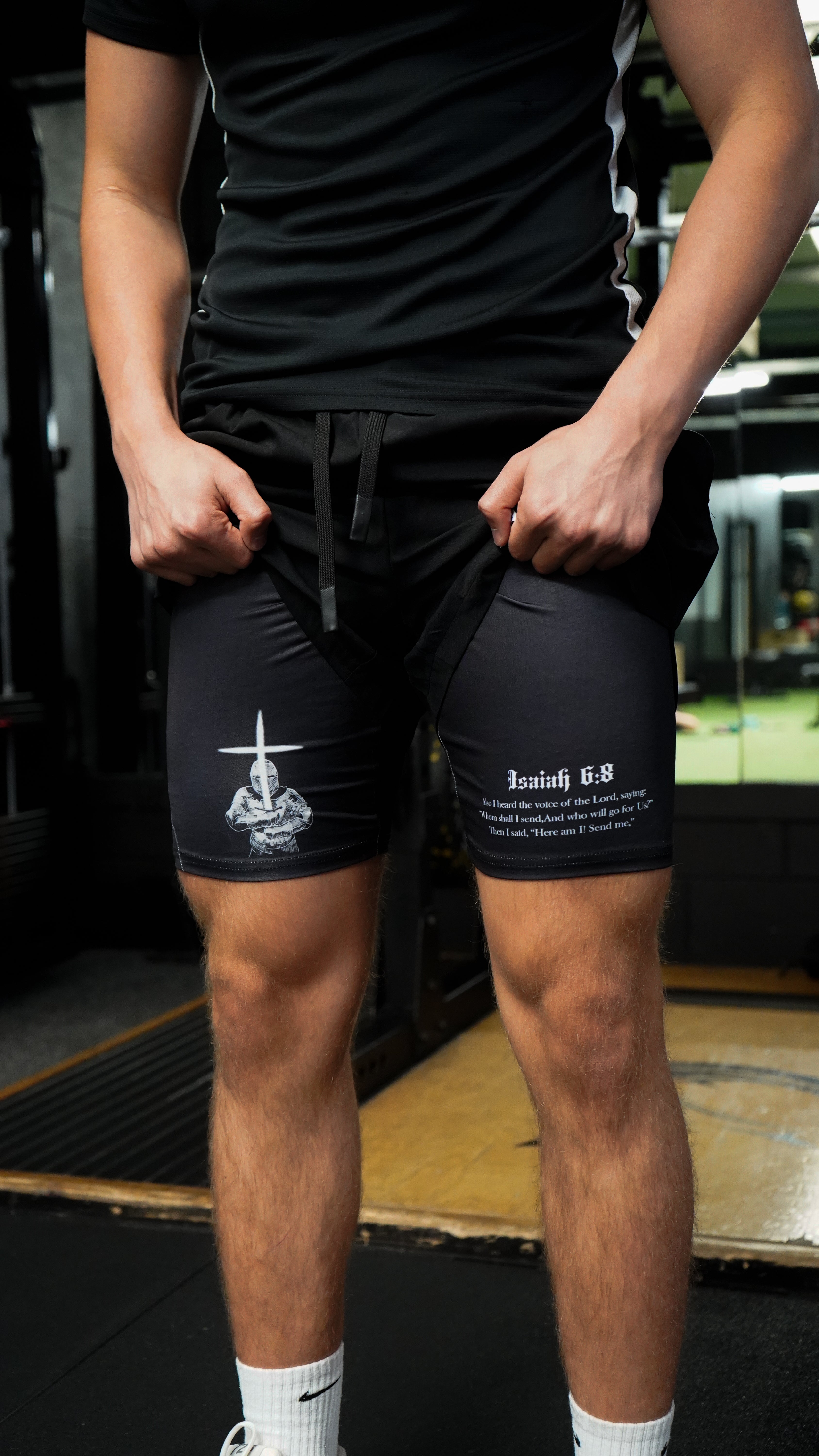 Christian-themed performance shorts with Bible verses, made from a blend of cotton and polyester with a spandex inner lining, featuring Saint Kaizen screen print and multiple pockets for convenience.