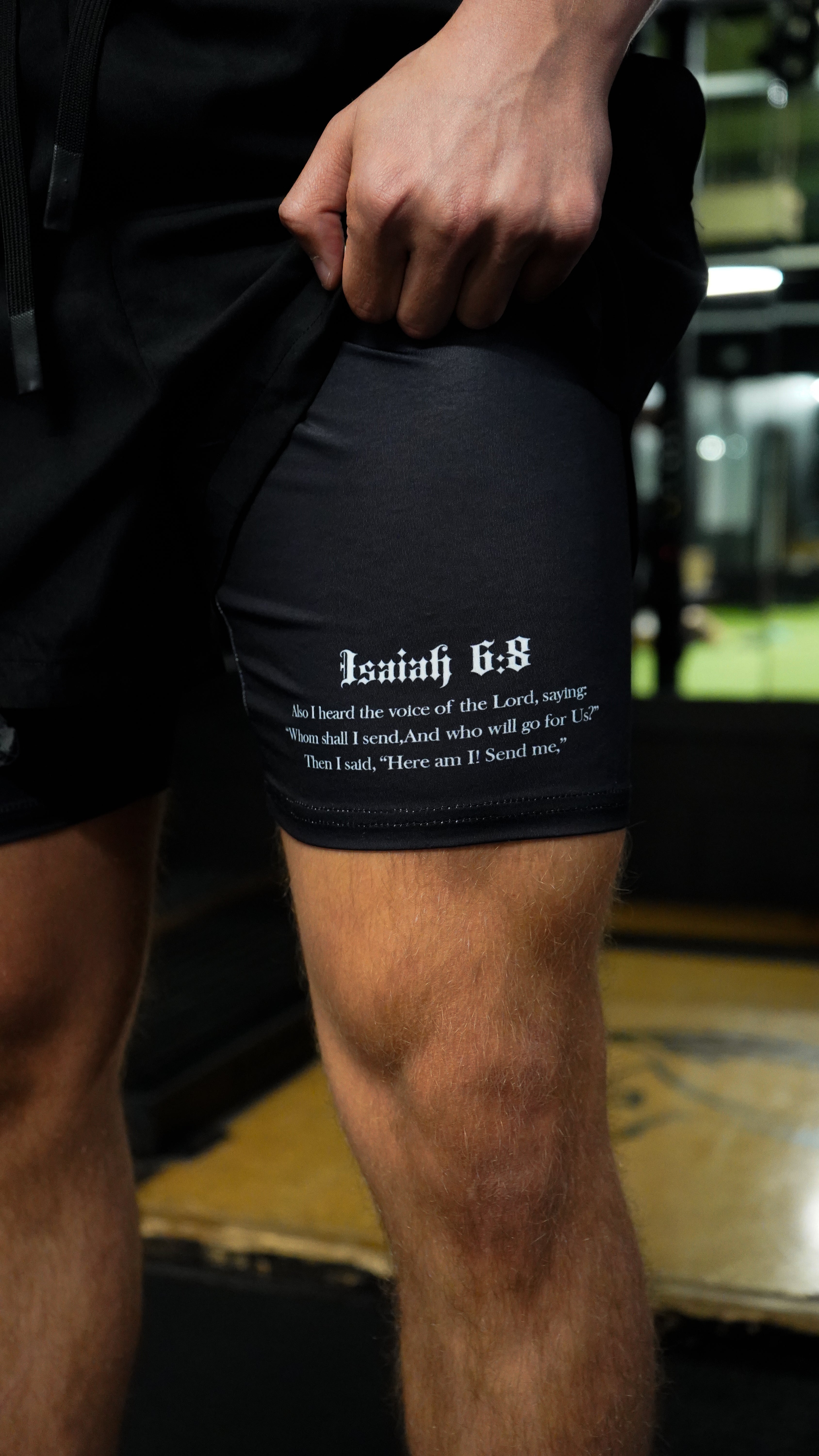 Christian-themed performance shorts with Bible verses, made from a blend of cotton and polyester with a spandex inner lining, featuring Saint Kaizen screen print and multiple pockets for convenience.