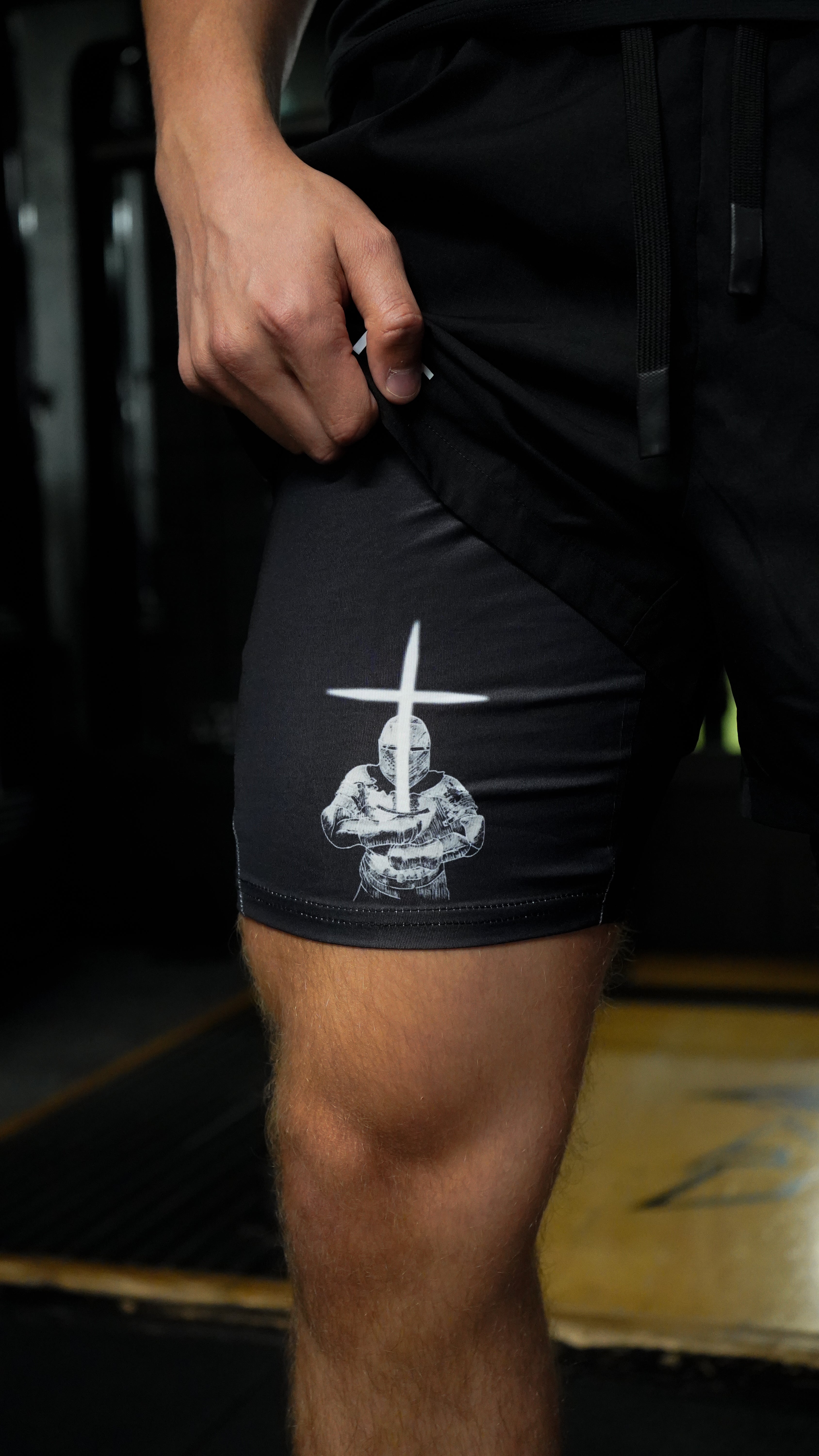 Christian-themed performance shorts with Bible verses, made from a blend of cotton and polyester with a spandex inner lining, featuring Saint Kaizen screen print and multiple pockets for convenience.