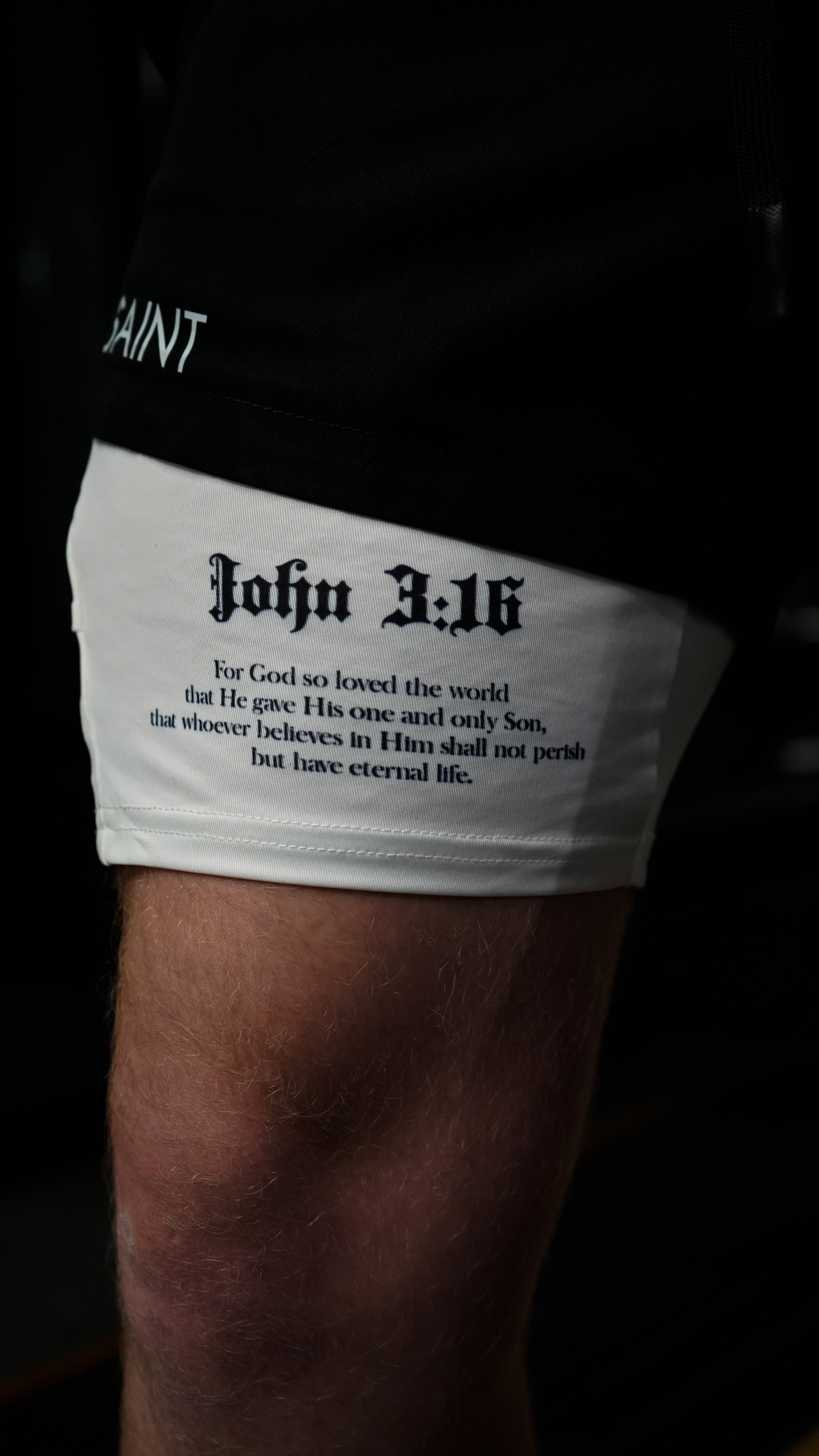 Christian-themed performance shorts with Bible verses, made from a blend of cotton and polyester with a spandex inner lining, featuring Saint Kaizen screen print and multiple pockets for convenience.