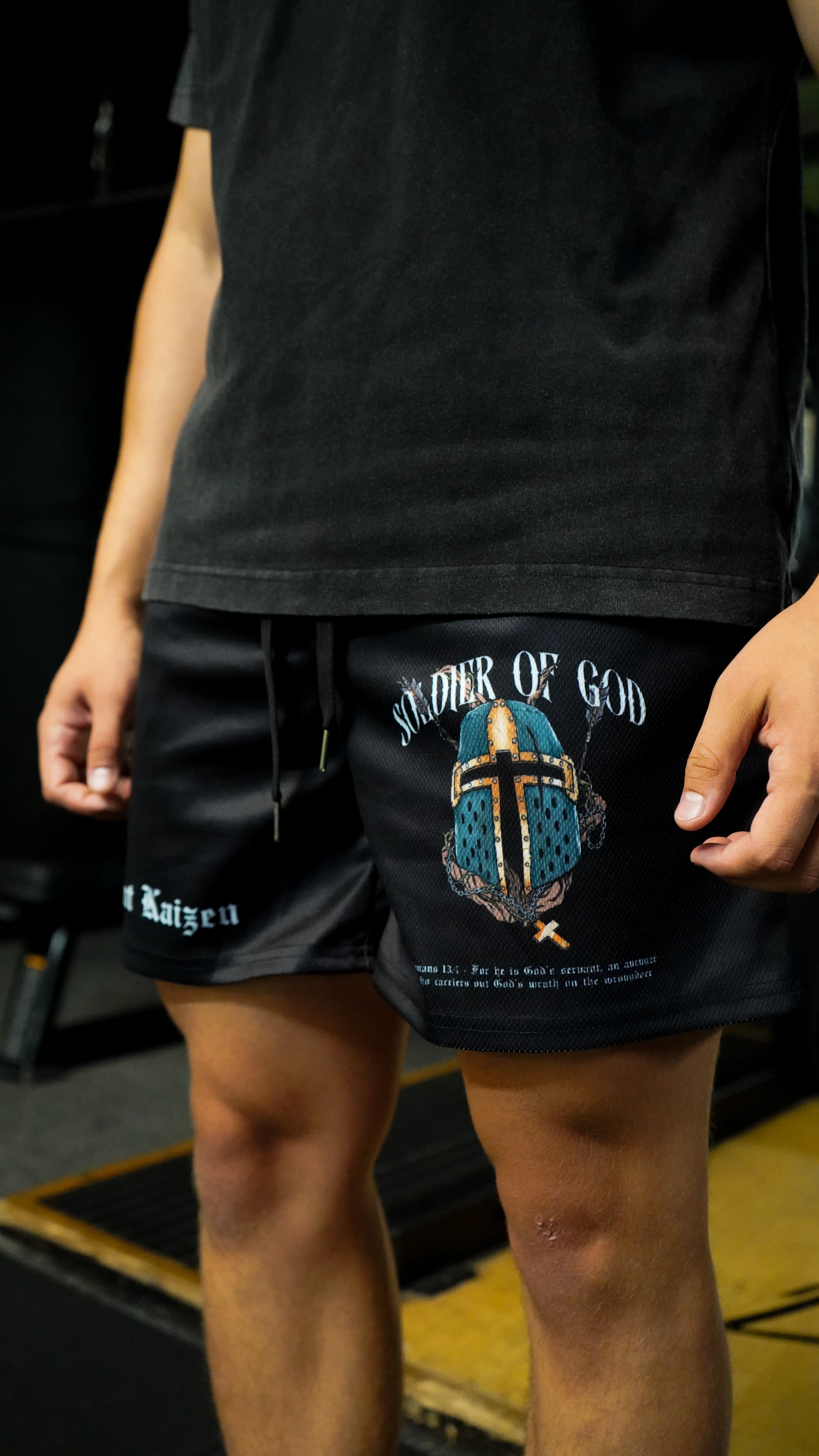 Christian-themed mesh gym shorts with Bible verses, made from 100% polyester, featuring double side pockets and a 5-inch inseam for comfort and mobility.