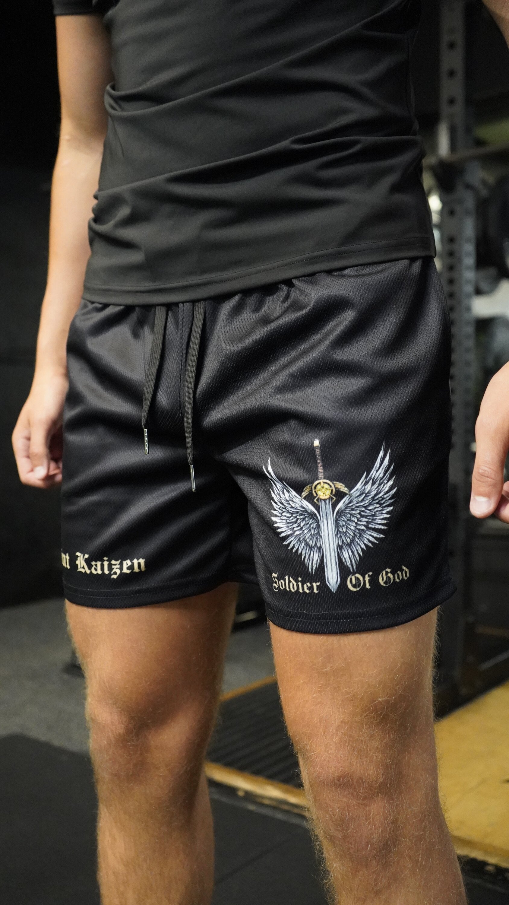 Christian-themed mesh gym shorts with Bible verses, made from 100% polyester, featuring double side pockets and a 5-inch inseam for comfort and mobility.