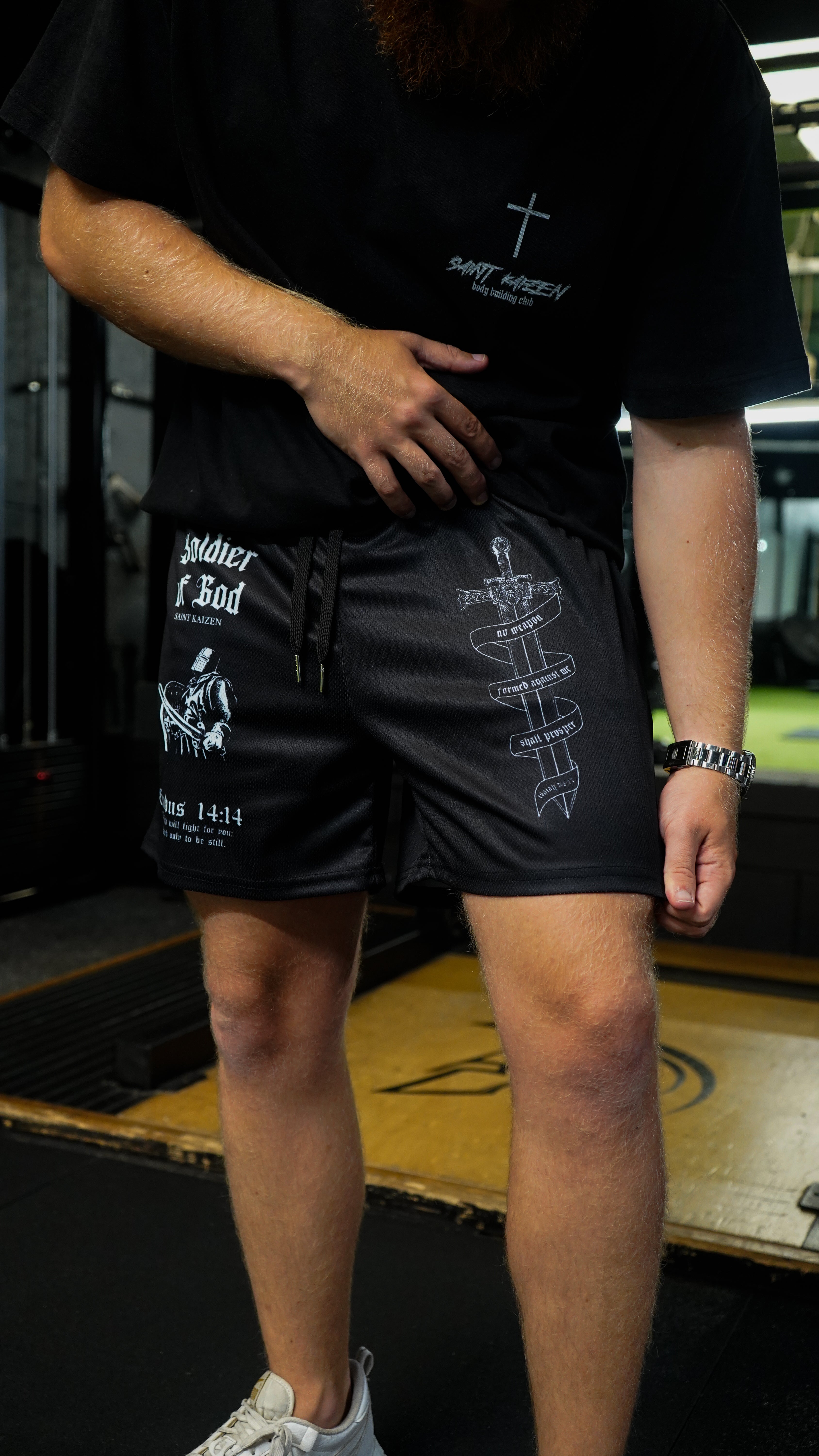 Christian-themed mesh gym shorts with Bible verses, made from 100% polyester, featuring double side pockets and a 5-inch inseam for comfort and mobility.