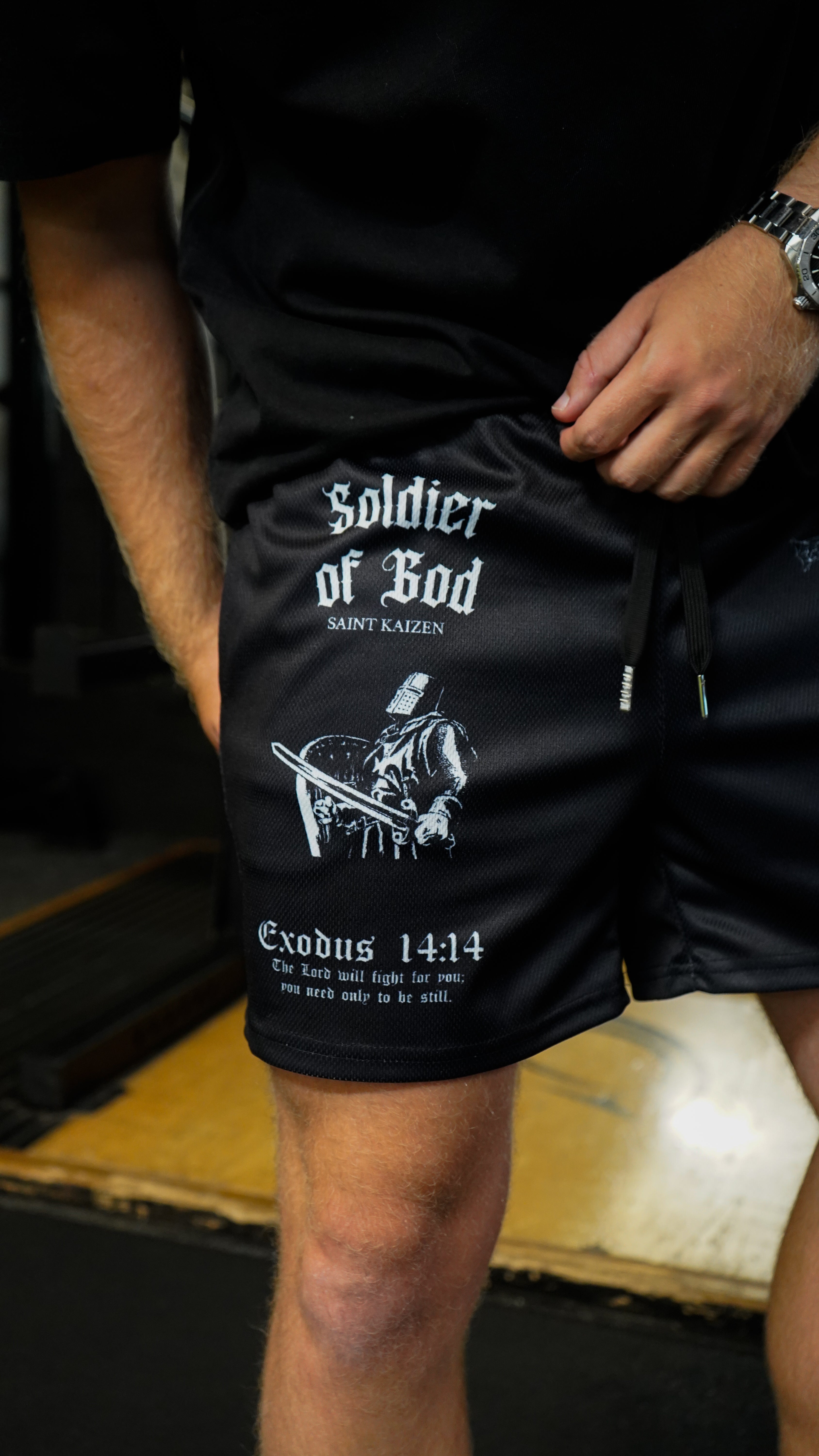 Christian-themed mesh gym shorts with Bible verses, made from 100% polyester, featuring double side pockets and a 5-inch inseam for comfort and mobility.