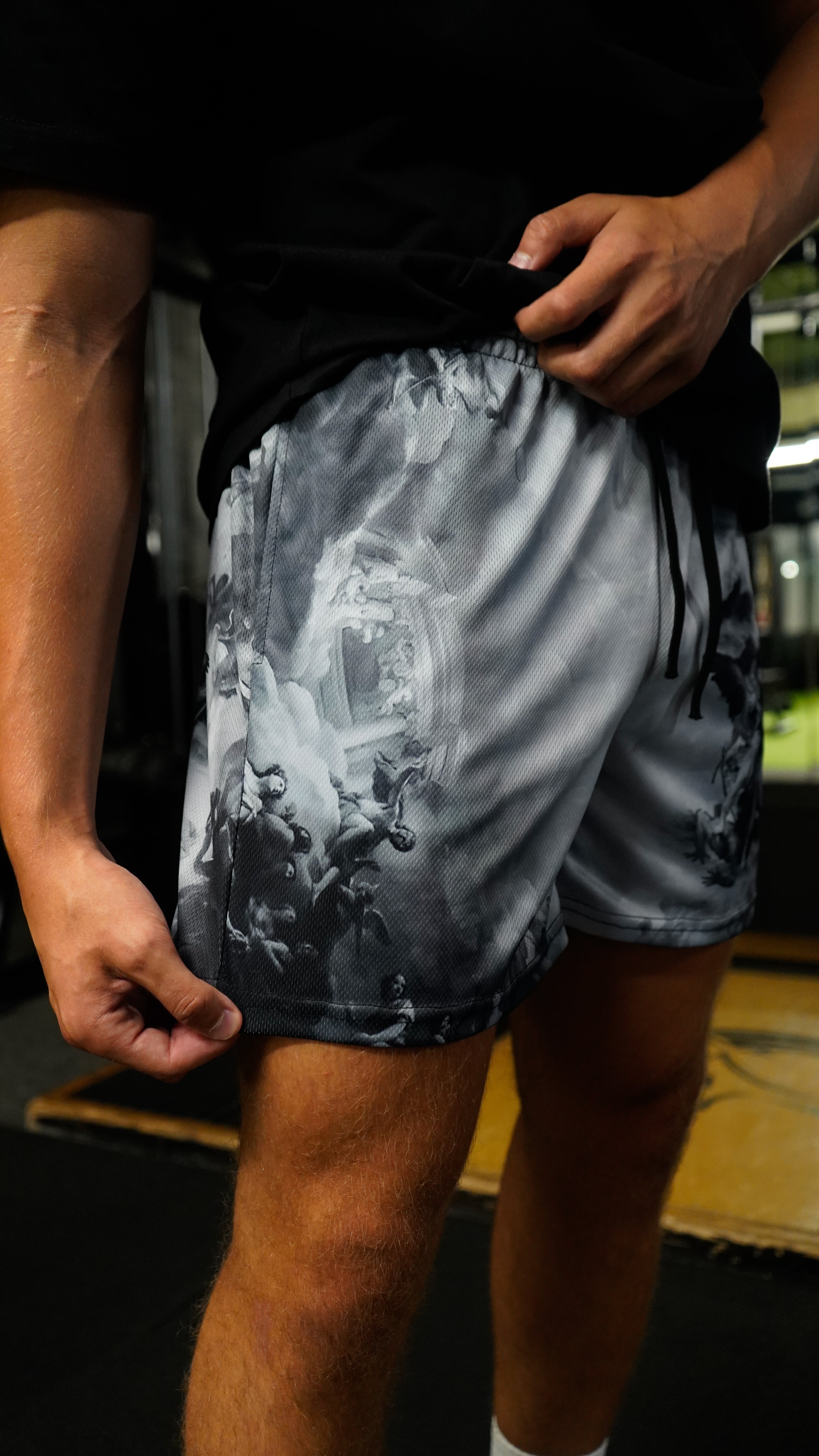 Christian-themed mesh gym shorts with Bible verses, made from 100% polyester, featuring double side pockets and a 5-inch inseam for comfort and mobility.