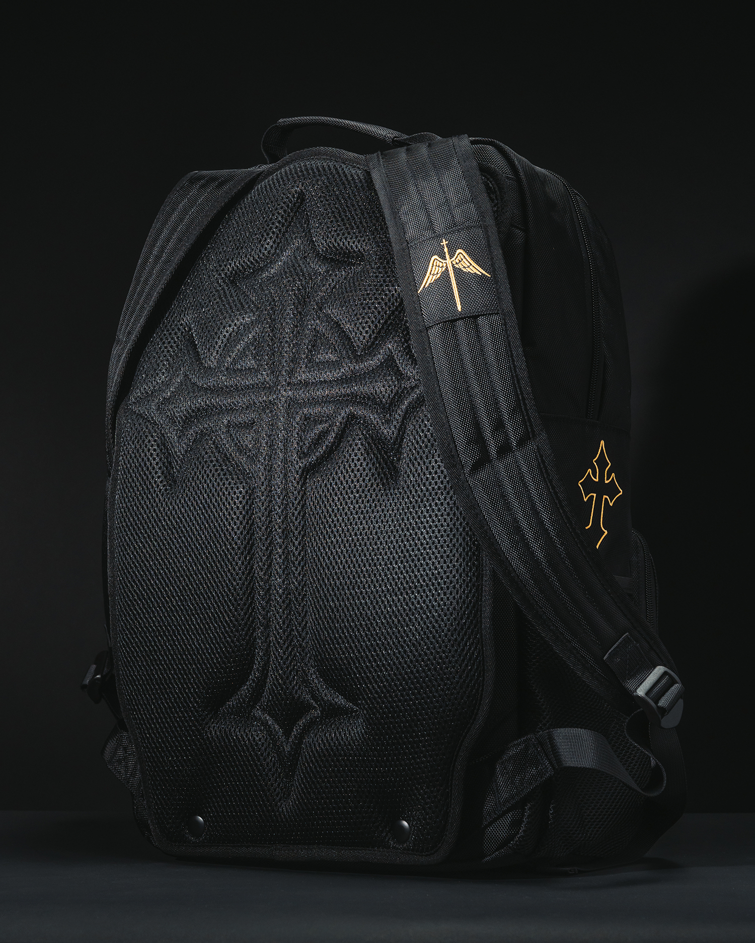 The back of the Fear Not Backpack showing the snap-secured Embossed Rear Plate and custom divine sword shoulder patch. A durable bag for Christians.