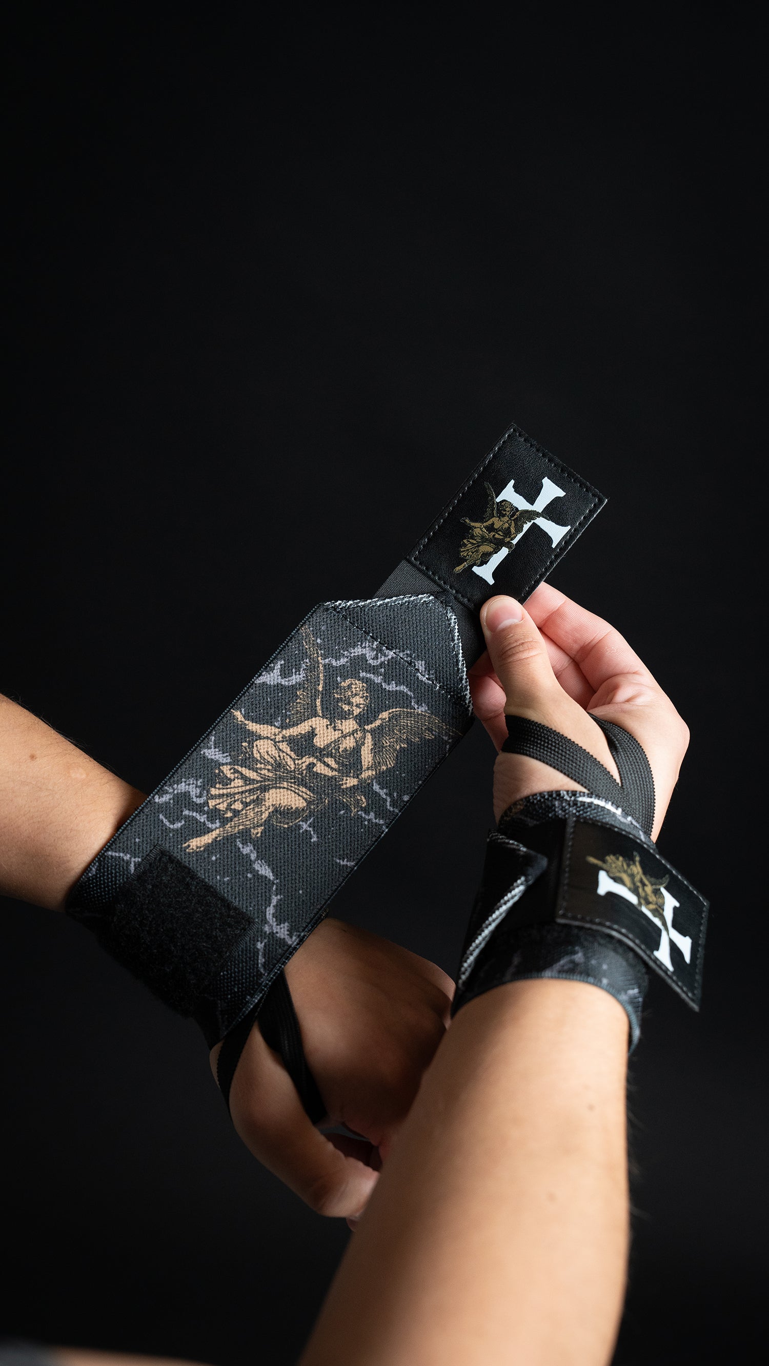 Saint Kaizen Guardian Angels Wrist Wraps. Christian gym wear accessory featuring bold spiritual print and heavy-duty Velcro for stability.