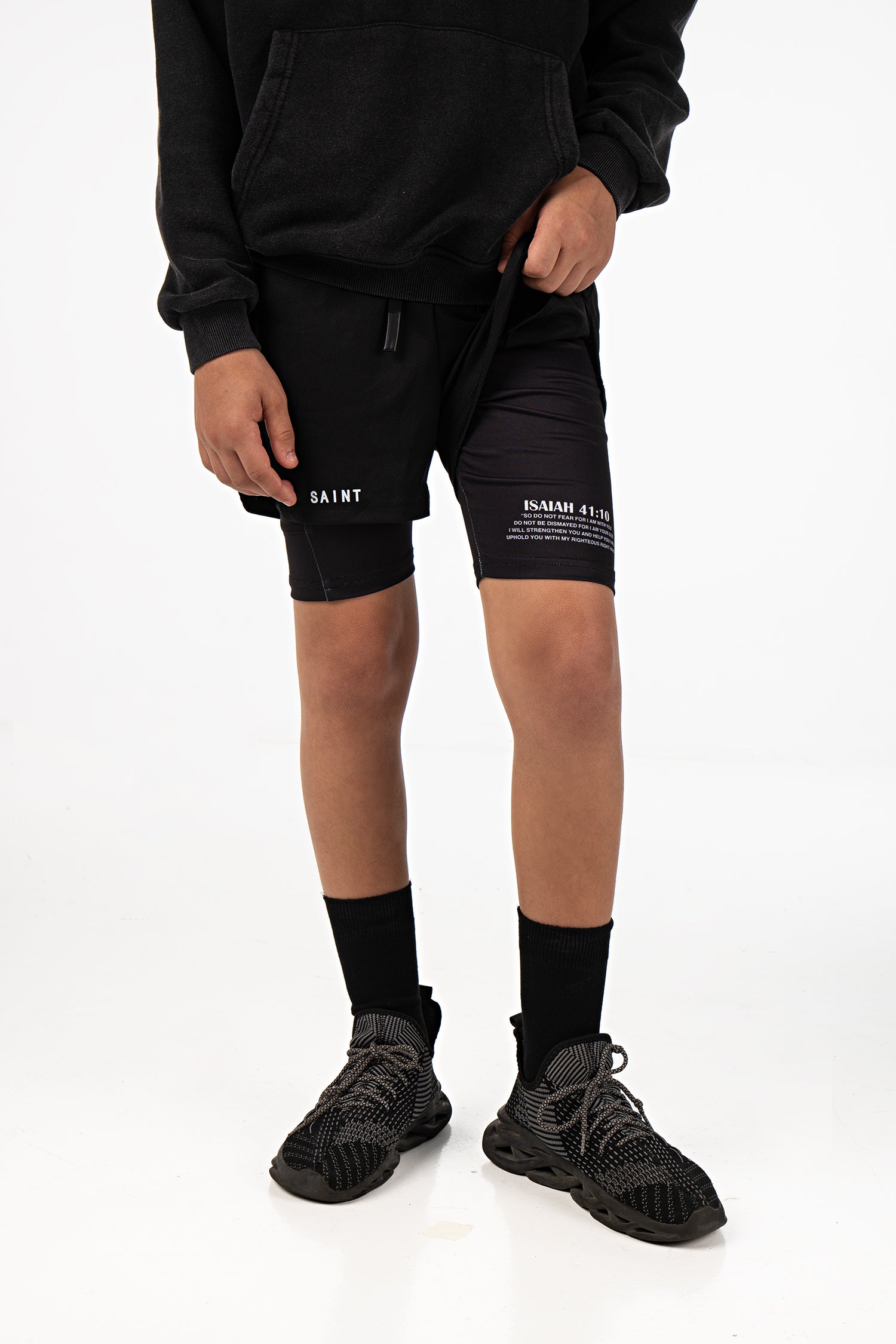 Saint Kaizen Christian gym wear Isaiah 41:10 Youth Performance Shorts. Two-layer shorts built for optimal mobility, featuring secure pockets and premium fabric.