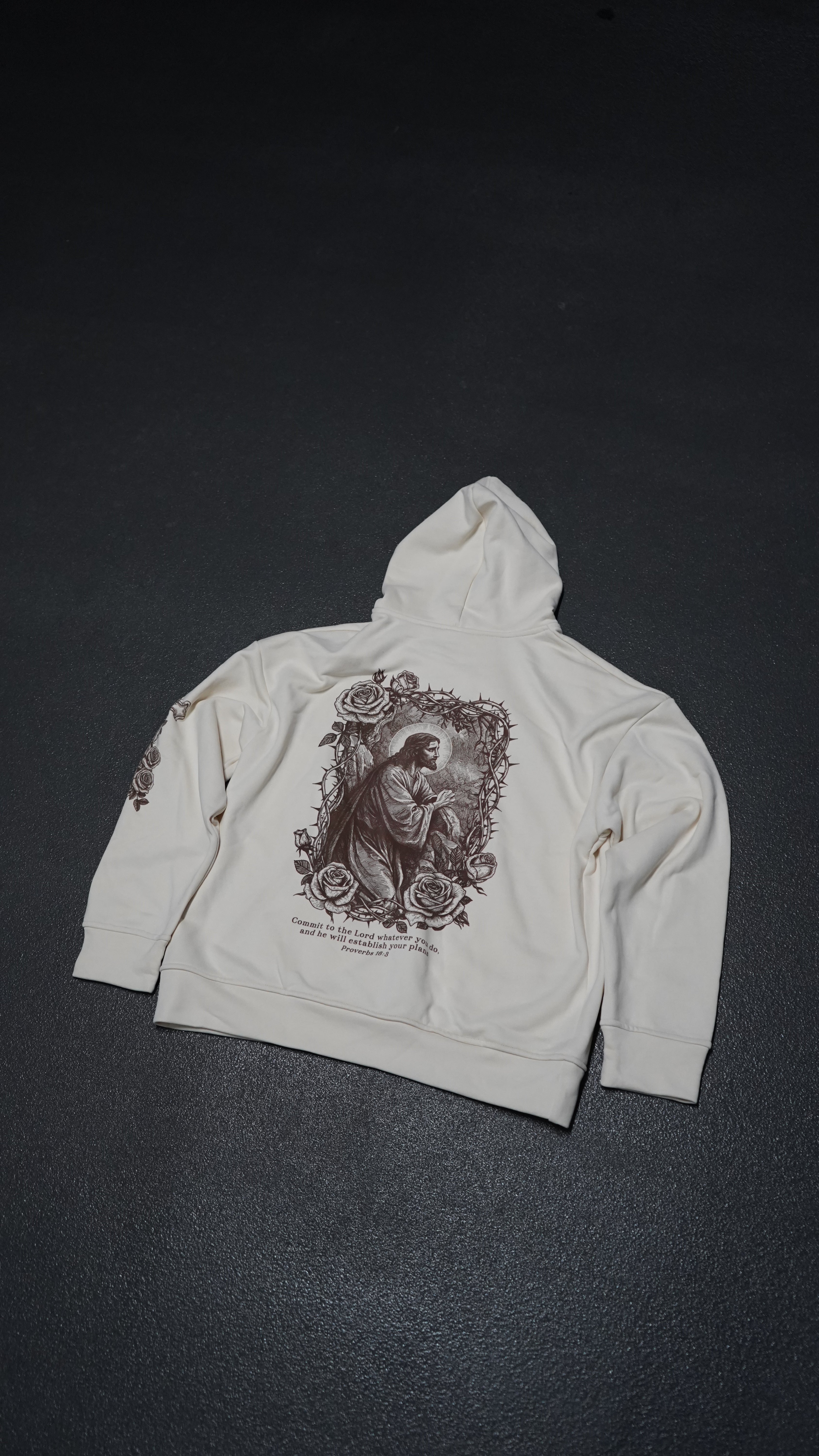 Saint Kaizen Proverbs 16:3 Hoodie - Cream. Heavyweight Christian gym wear hoodie featuring a durable with spiritual artwork.