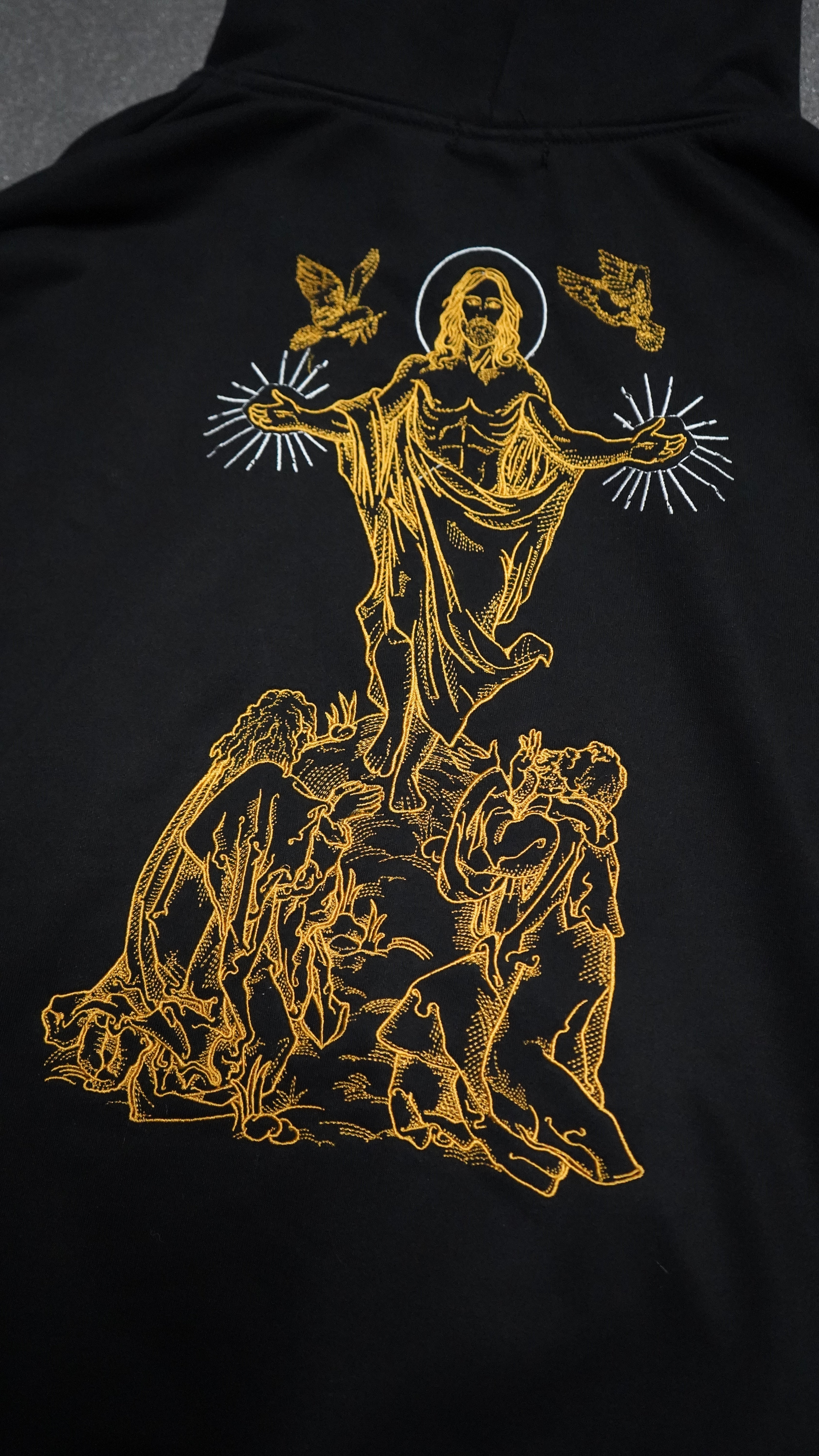 Saint Kaizen Resurrection Embroidery Hoodie. Heavyweight Christian gym wear hoodie featuring detailed embroidered spiritual artwork.