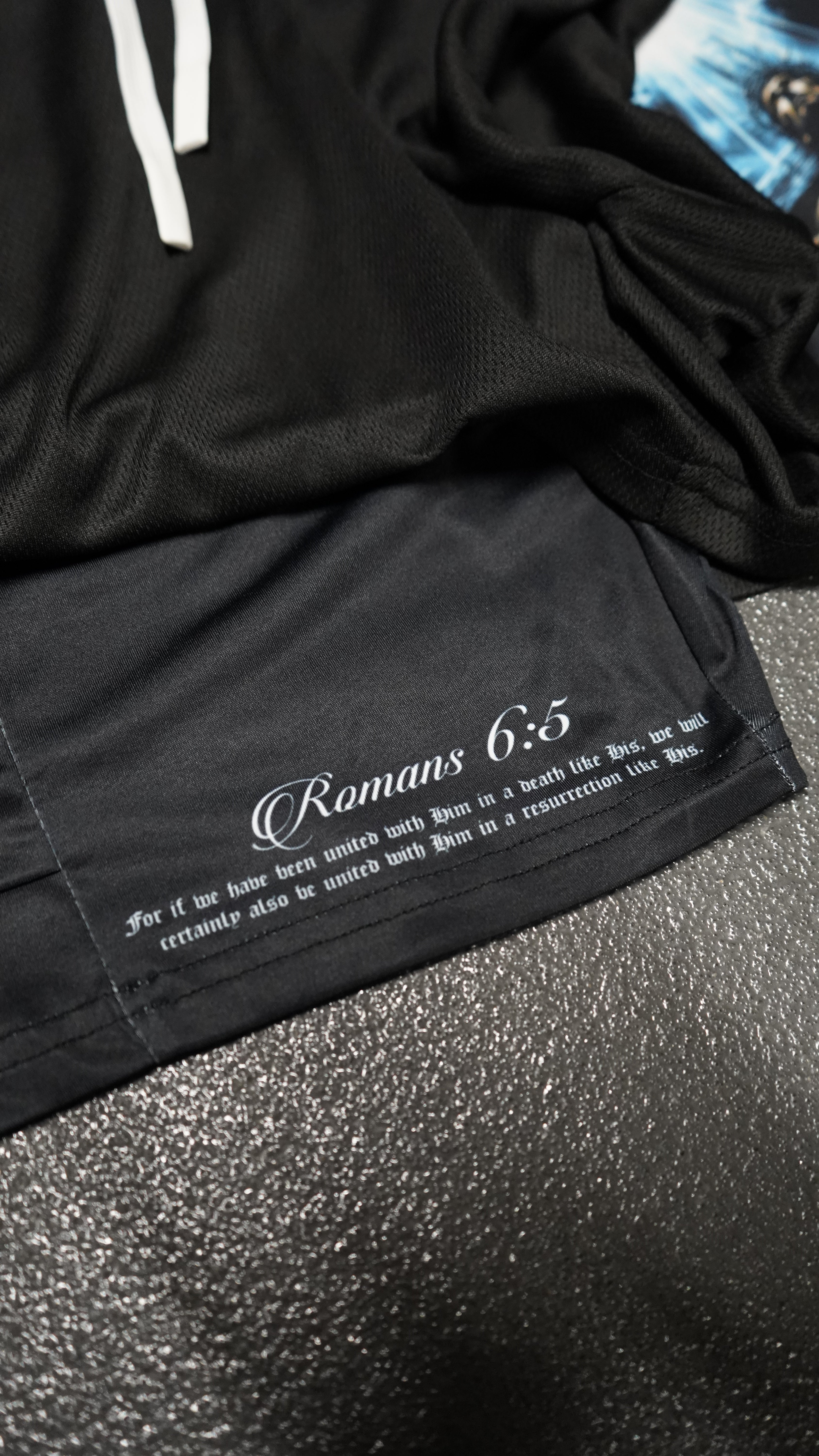 Saint Kaizen Christian gym wear Romans 5:6 Performance Shorts. Two-layer shorts built for optimal mobility, featuring secure pockets and premium fabric.