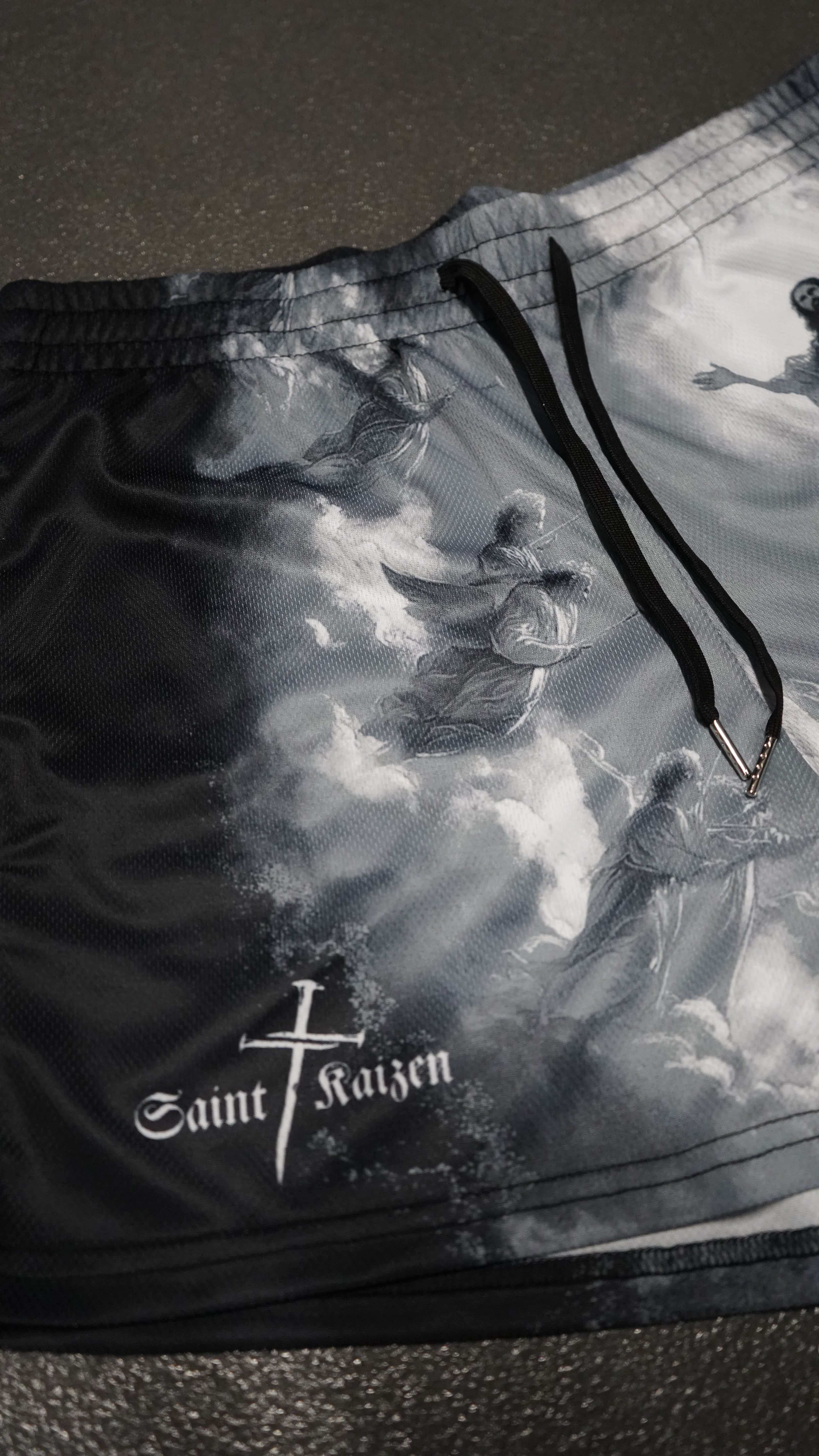 Saint Kaizen Christian gym wear Saviour Shorts. Lightweight 100% polyester mesh with bold printed spiritual design. Features a 5-inch inseam for mobility.