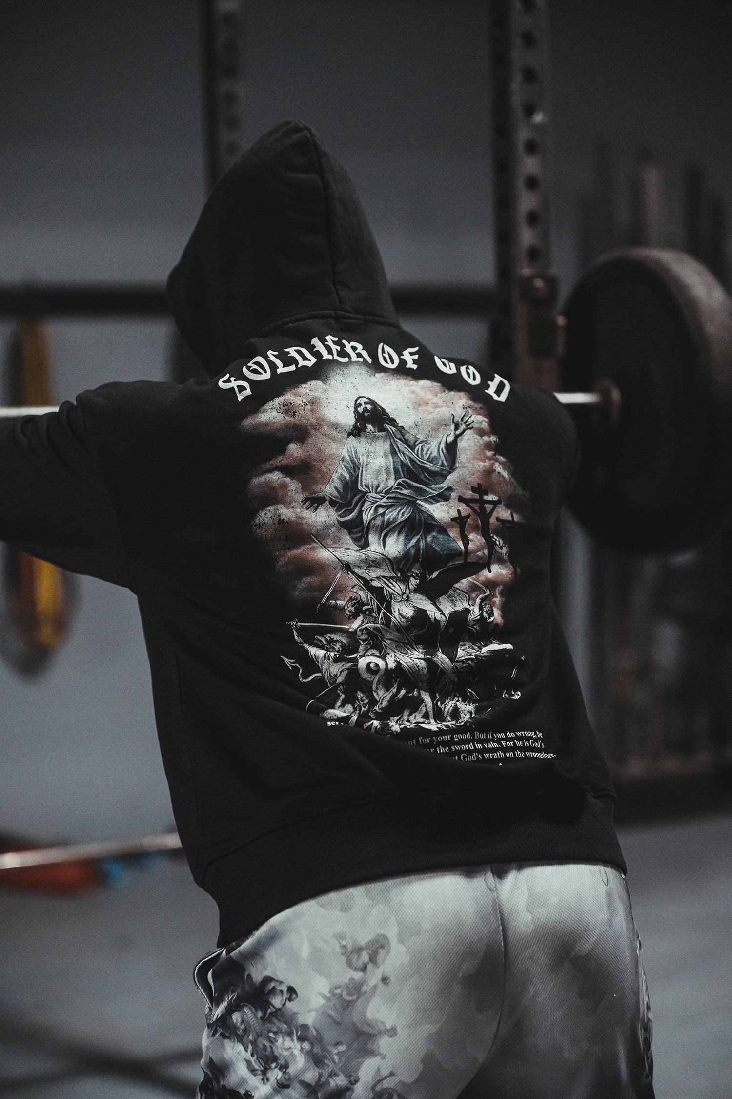 Saint Kaizen Soldier of God Hoodie Black. Heavyweight Christian gym wear hoodie featuring a durable with spiritual artwork.
