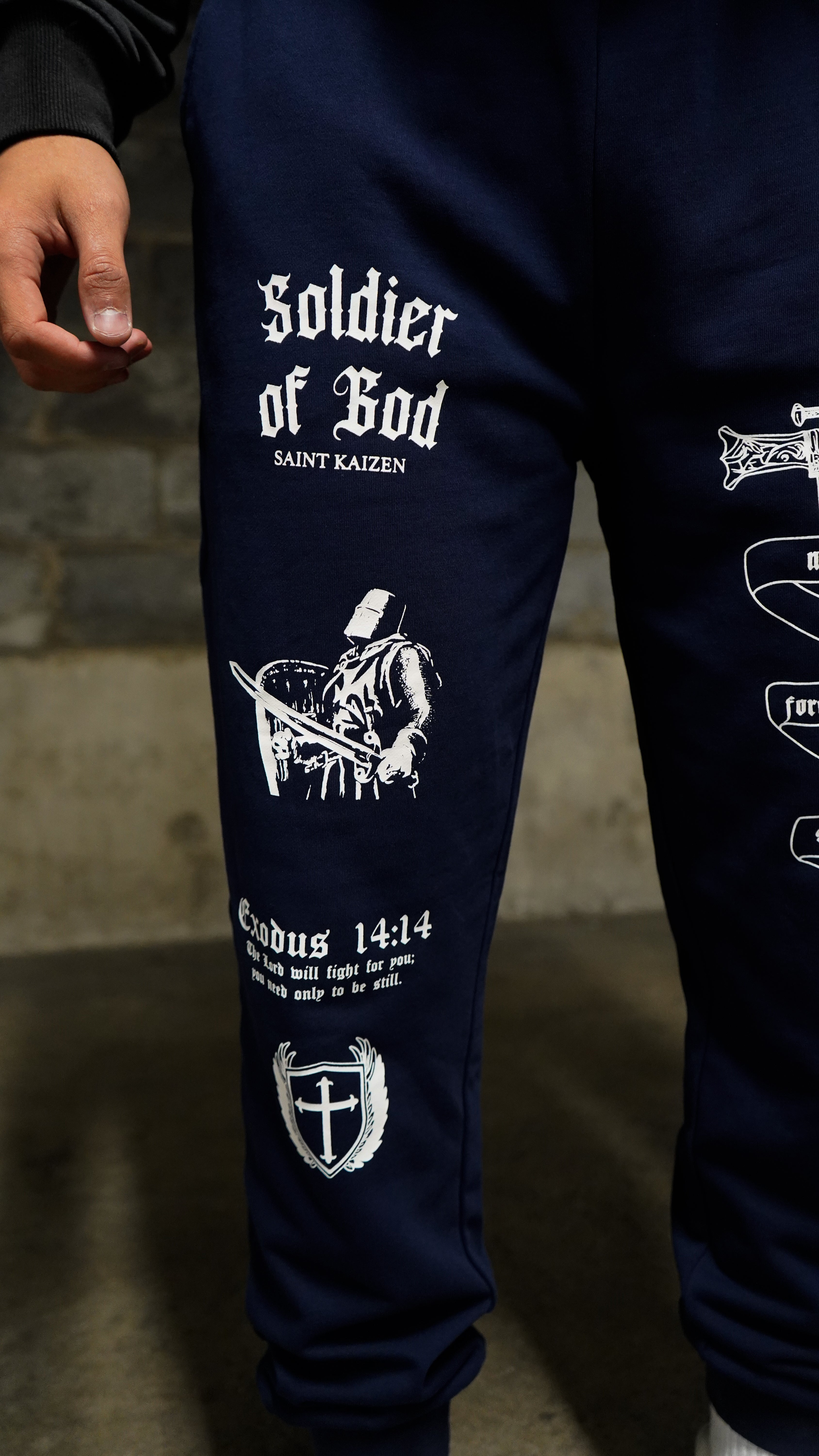 Saint Kaizen Soldier of God Joggers - Navy. Christian gym wear with high-quality screen print design. Terry fleece lining for warmth and comfort.