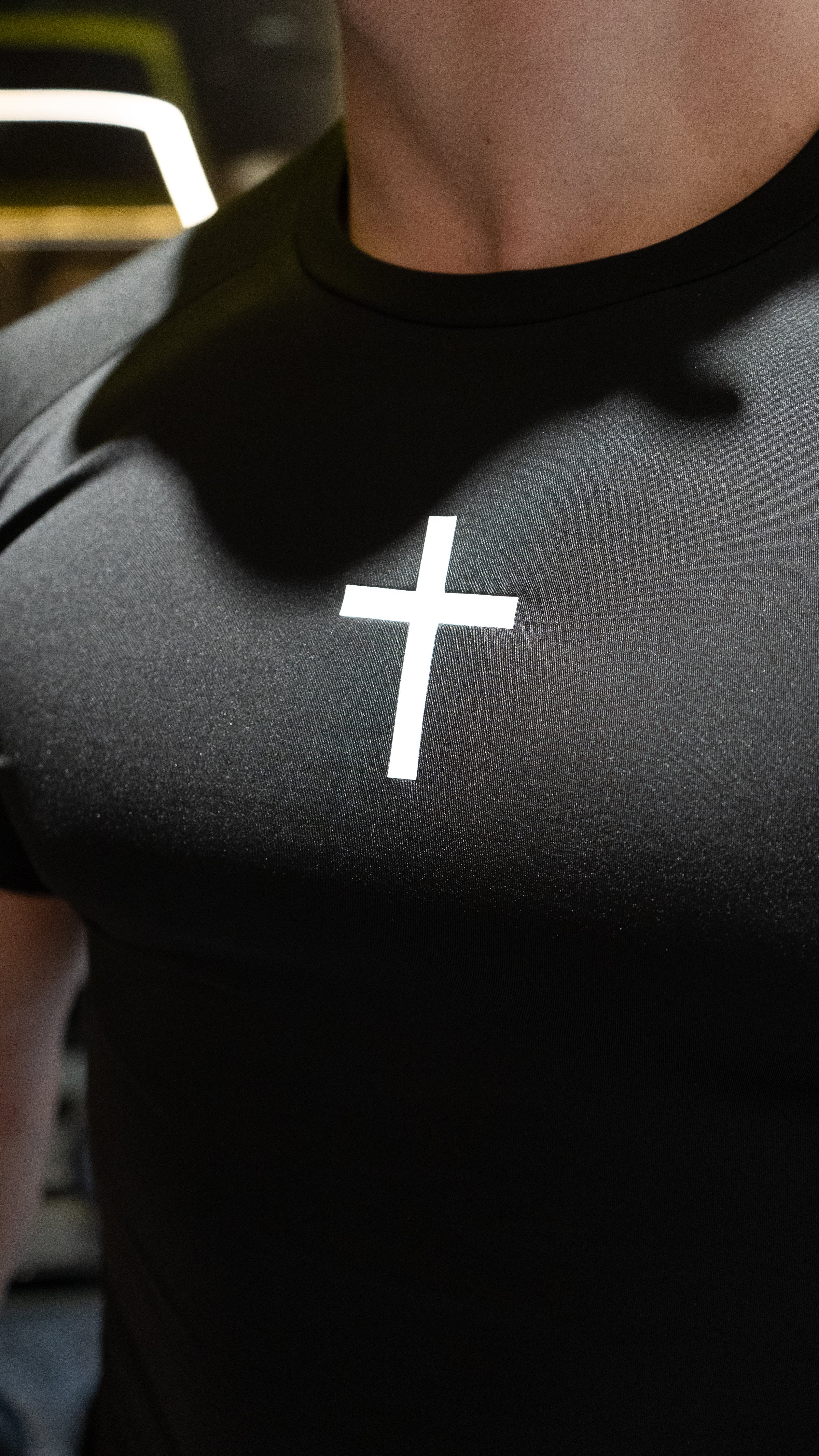 Christian-themed Compression Tee from Gym Wear, featuring gentle compression, moisture-wicking technology, and a second-skin feel for optimal performance and comfort during workouts.