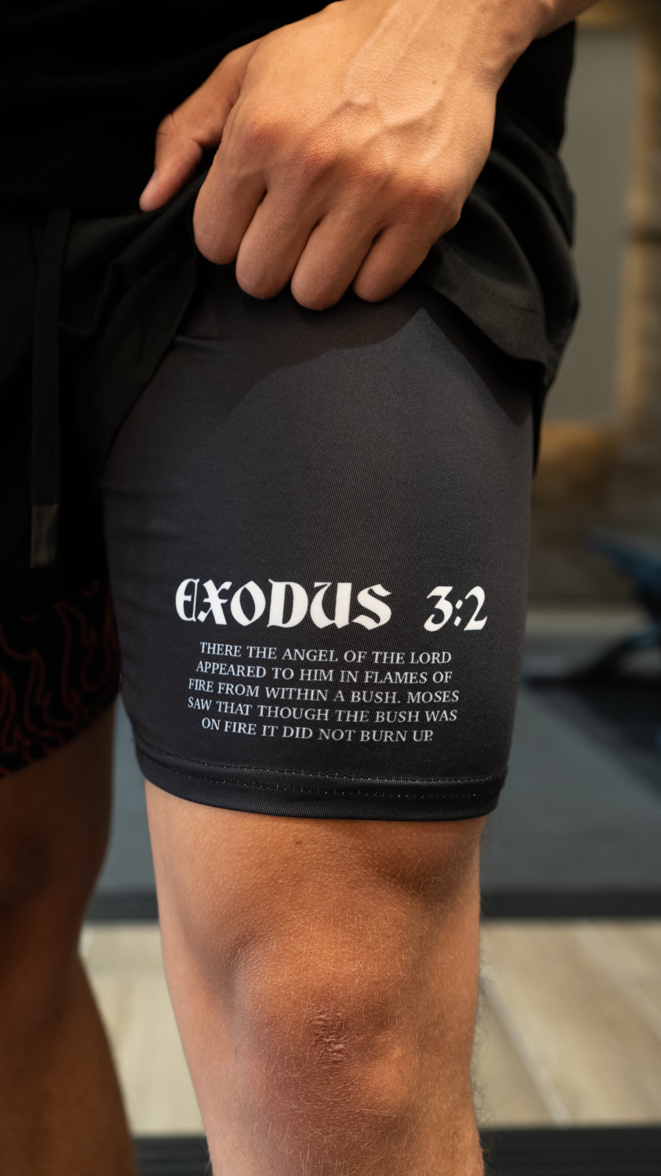 Christian-themed performance shorts with Bible verses, made from a blend of cotton and polyester with a spandex inner lining, featuring Saint Kaizen screen print and multiple pockets for convenience.