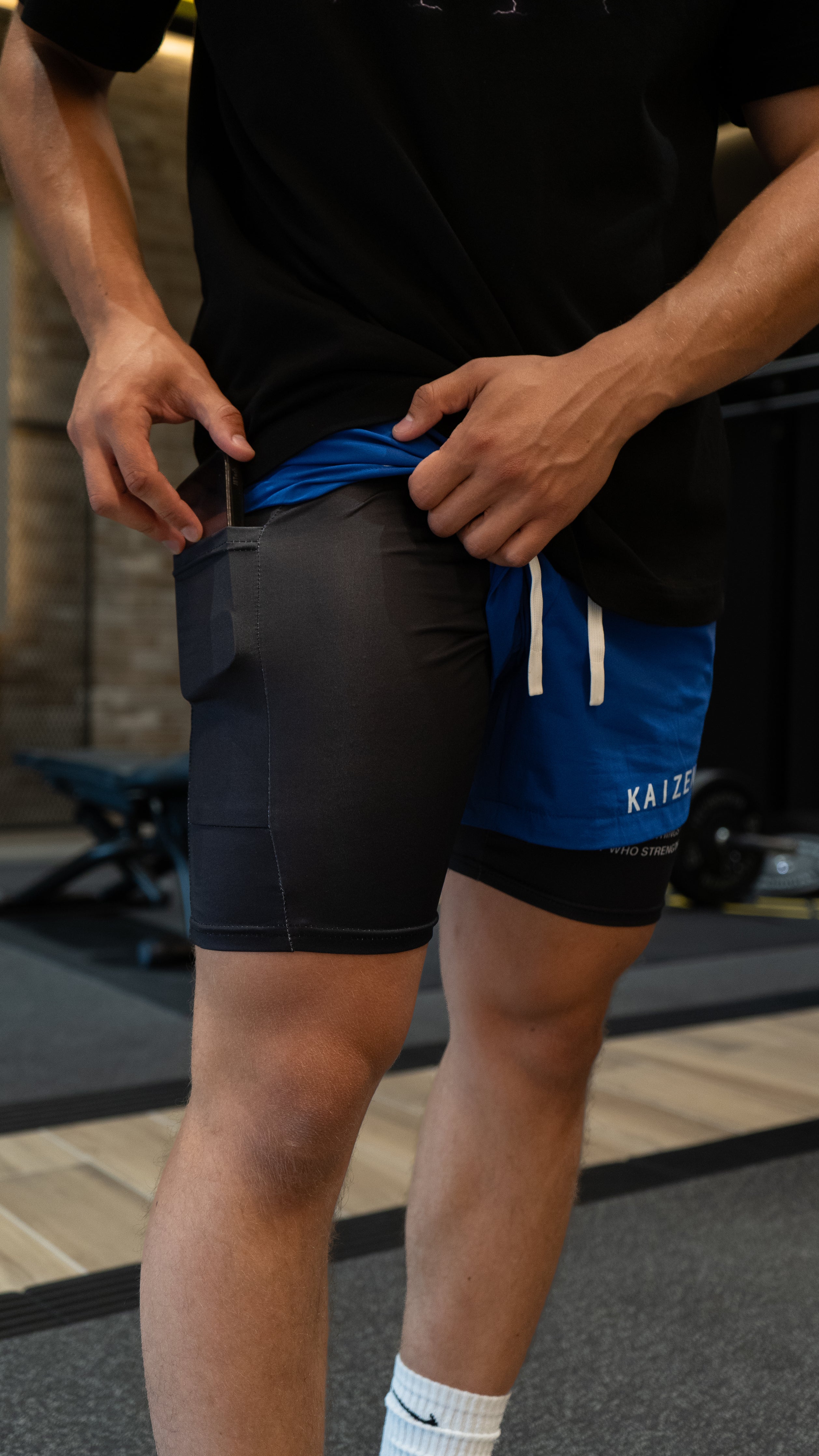 Christian-themed performance shorts with Bible verses, made from a blend of cotton and polyester with a spandex inner lining, featuring Saint Kaizen screen print and multiple pockets for convenience.