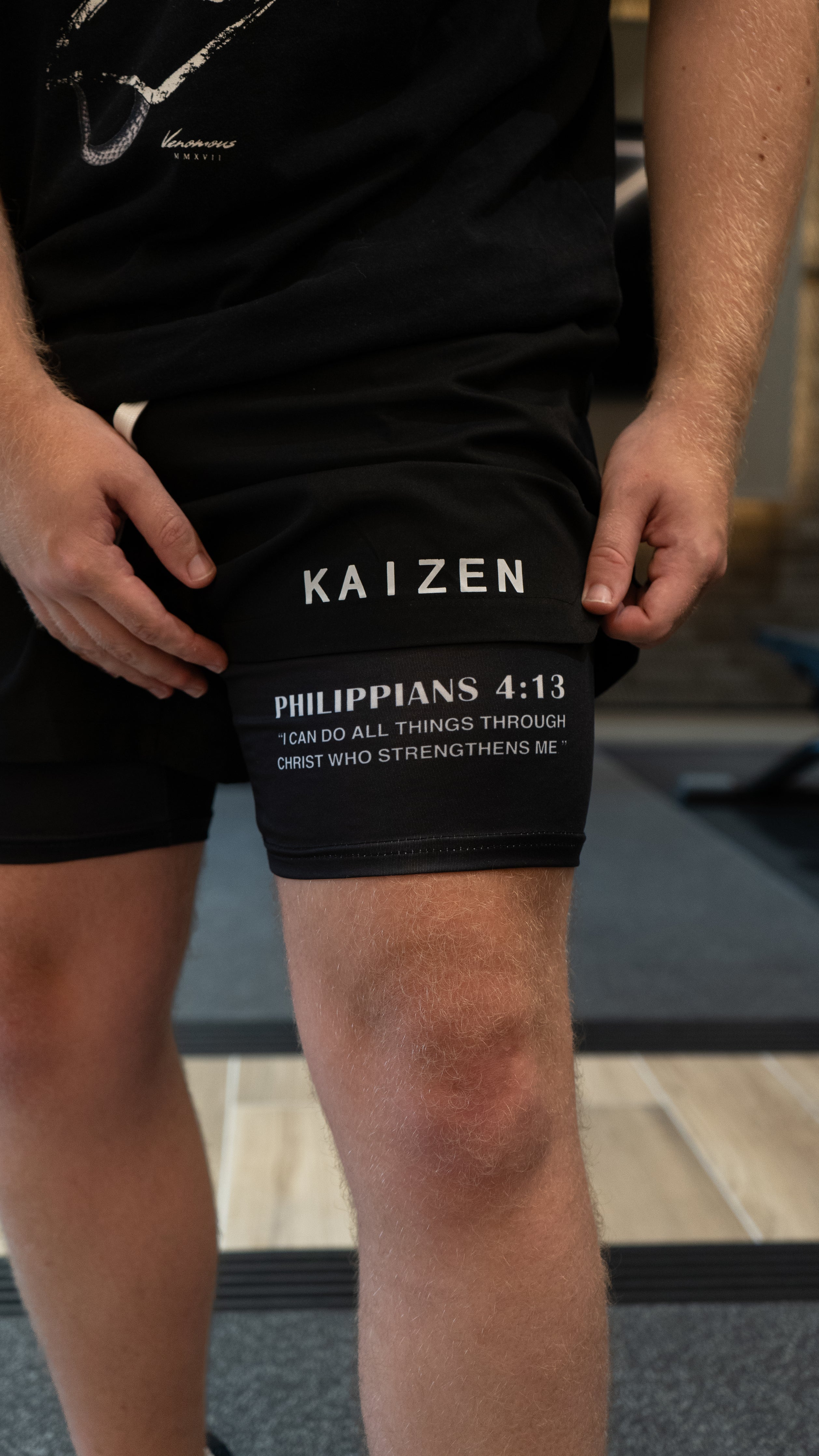 Christian-themed performance shorts with Bible verses, made from a blend of cotton and polyester with a spandex inner lining, featuring Saint Kaizen screen print and multiple pockets for convenience.